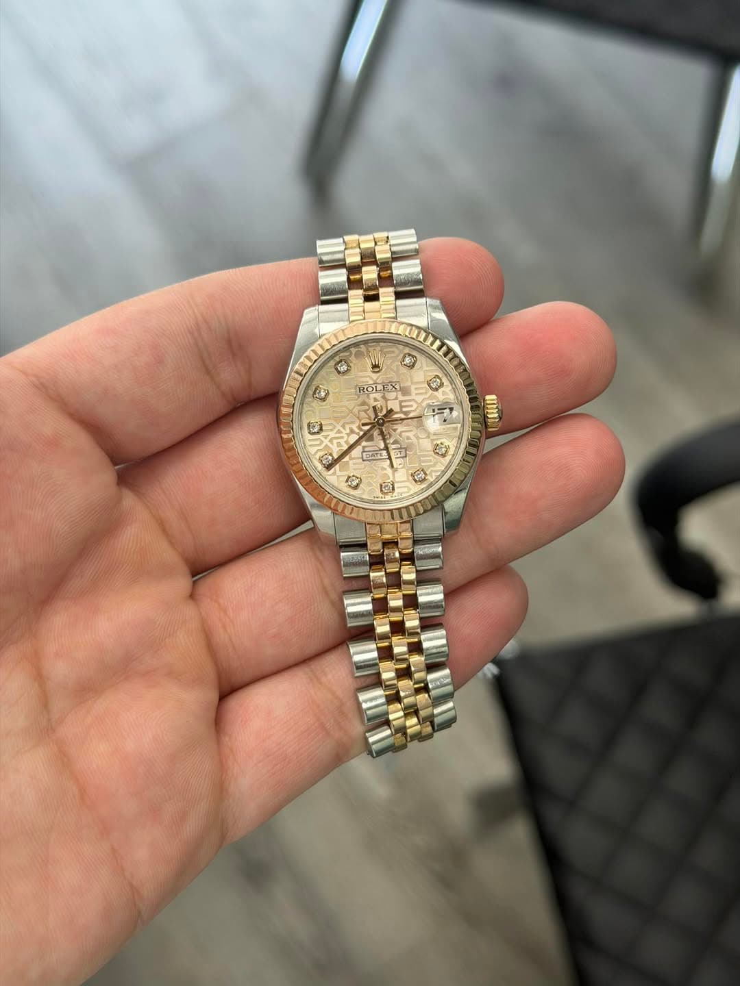 May be an image of wrist watch and text