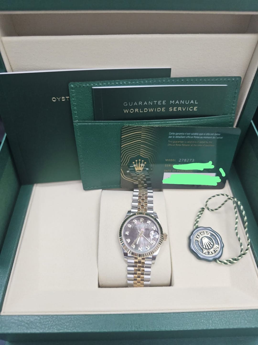 May be an image of wrist watch and text