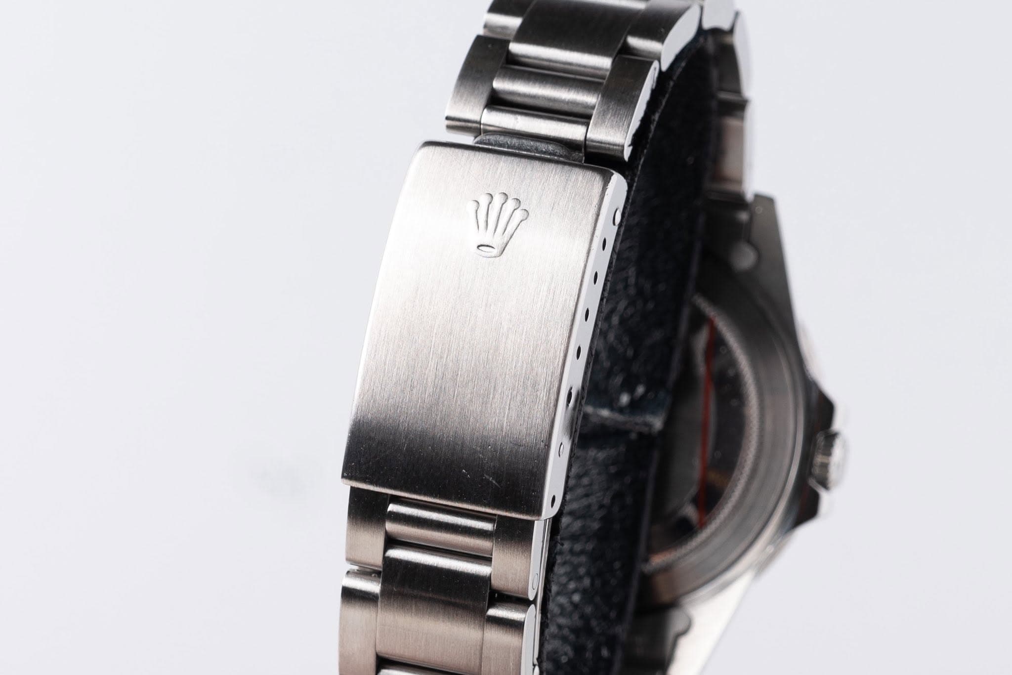 May be an image of wrist watch and text