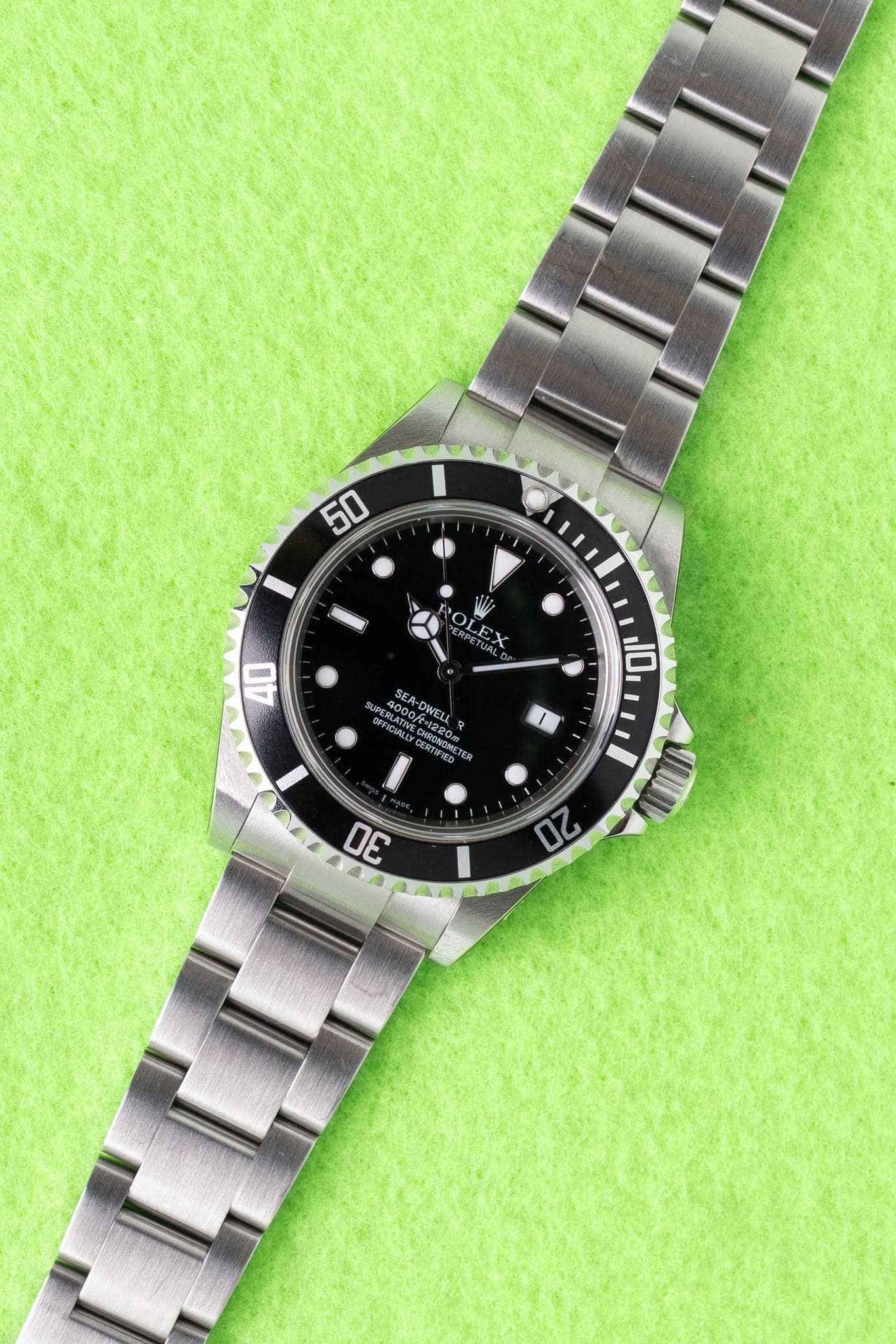 May be an image of wrist watch and text that says '50 50 LP 40 10 SEA-DWEL CERTET ORONE il UL 3 20'