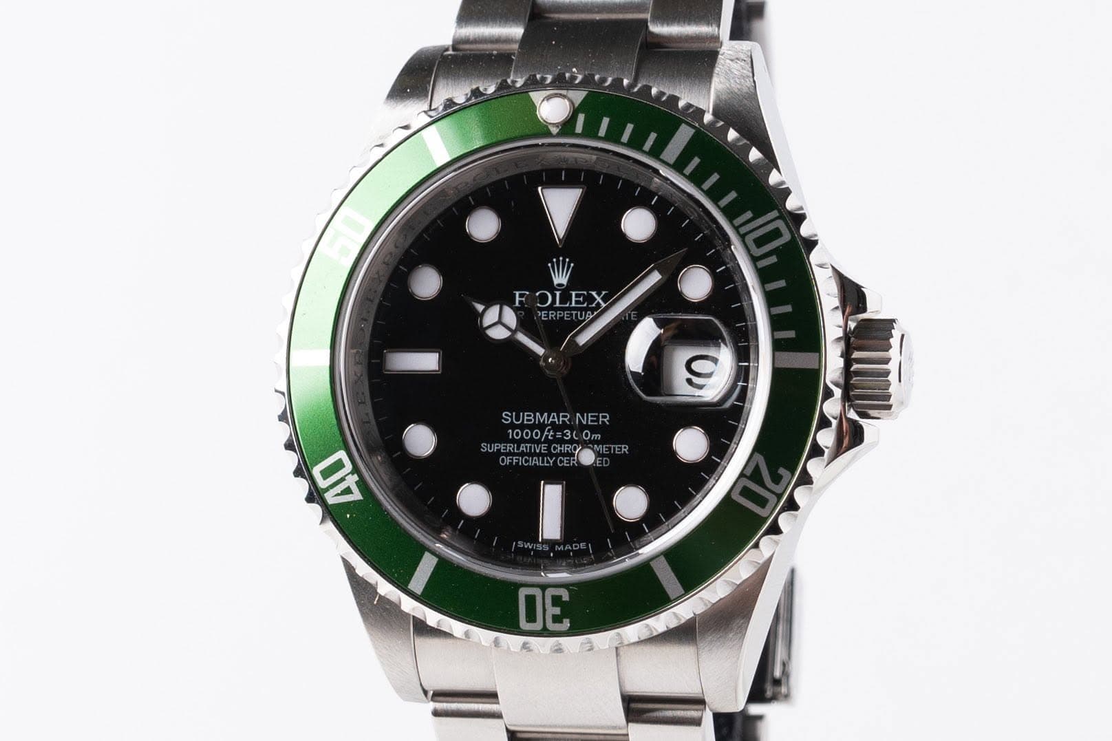 May be an image of wrist watch and text that says 'FOLEX su SUBMAR.NER NER 1000ft=3L0m 1000/t UPERLATIVEC PERLATVECHR 9 AO LAAYS E'