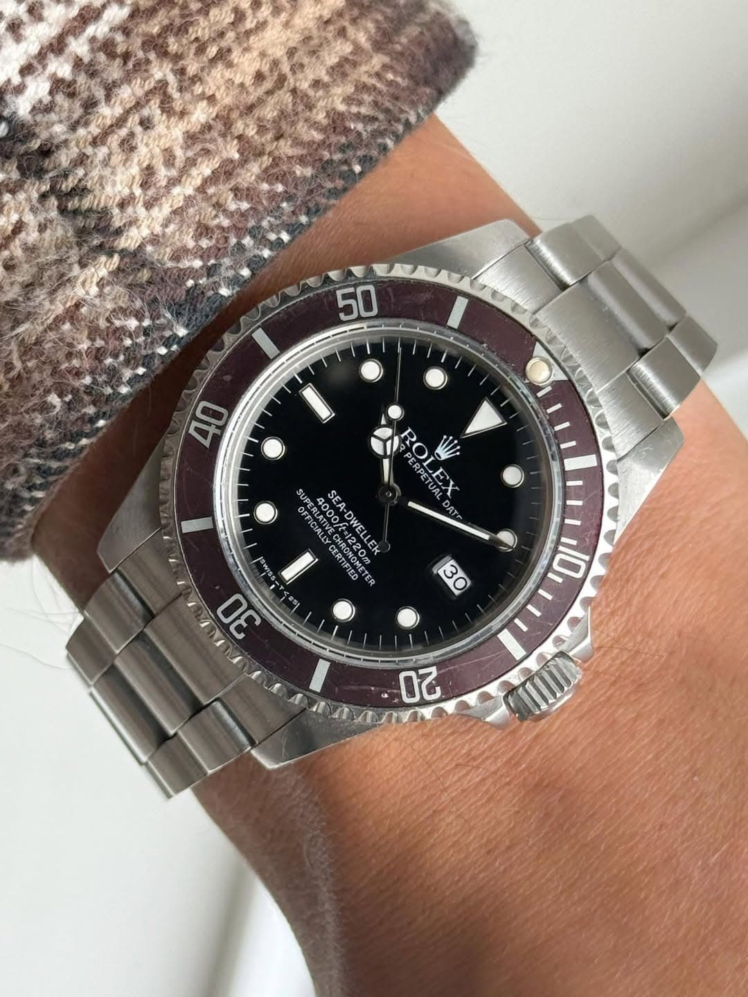 May be an image of wrist watch and text