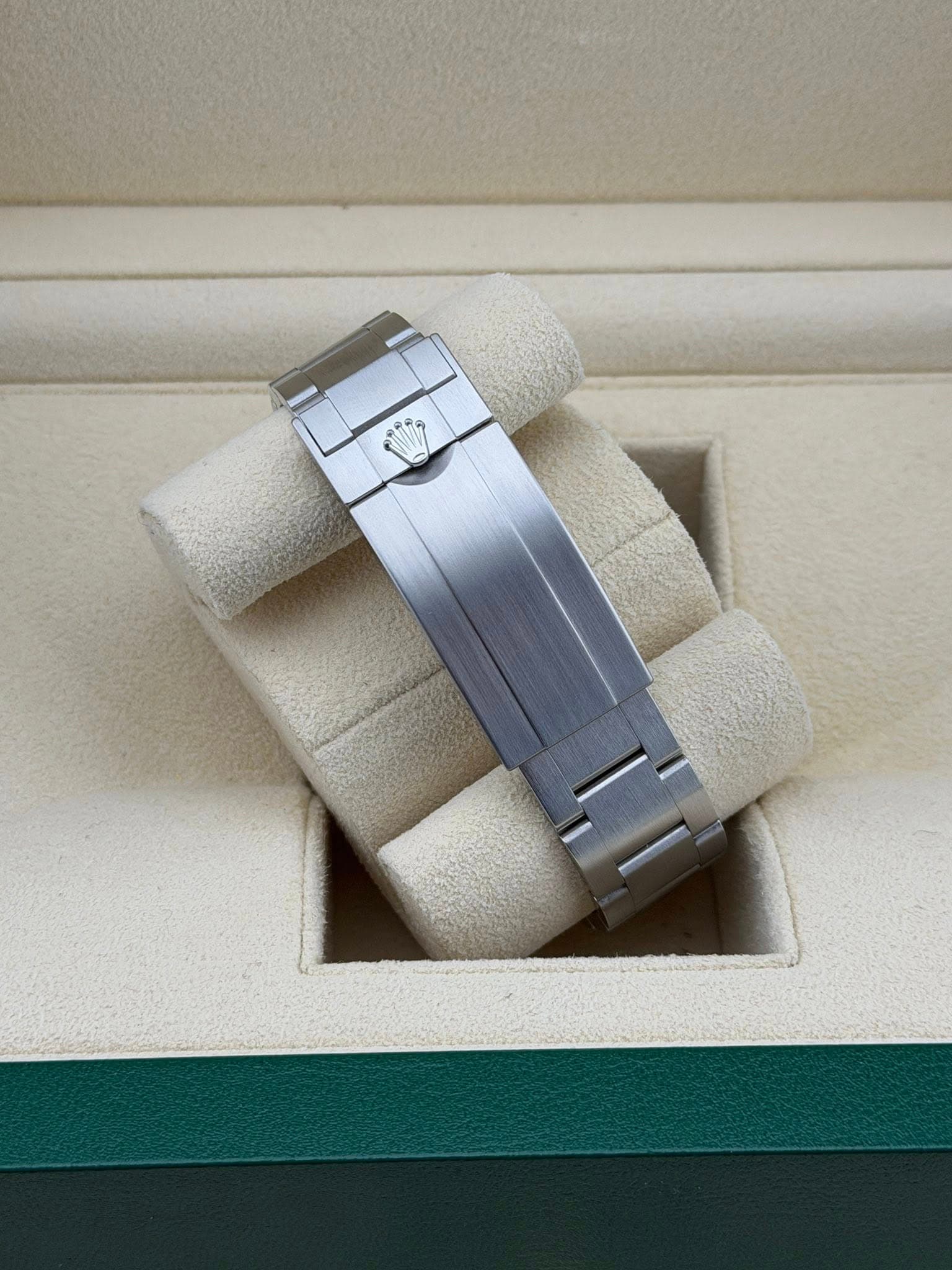 May be an image of jewelry, wrist watch and text