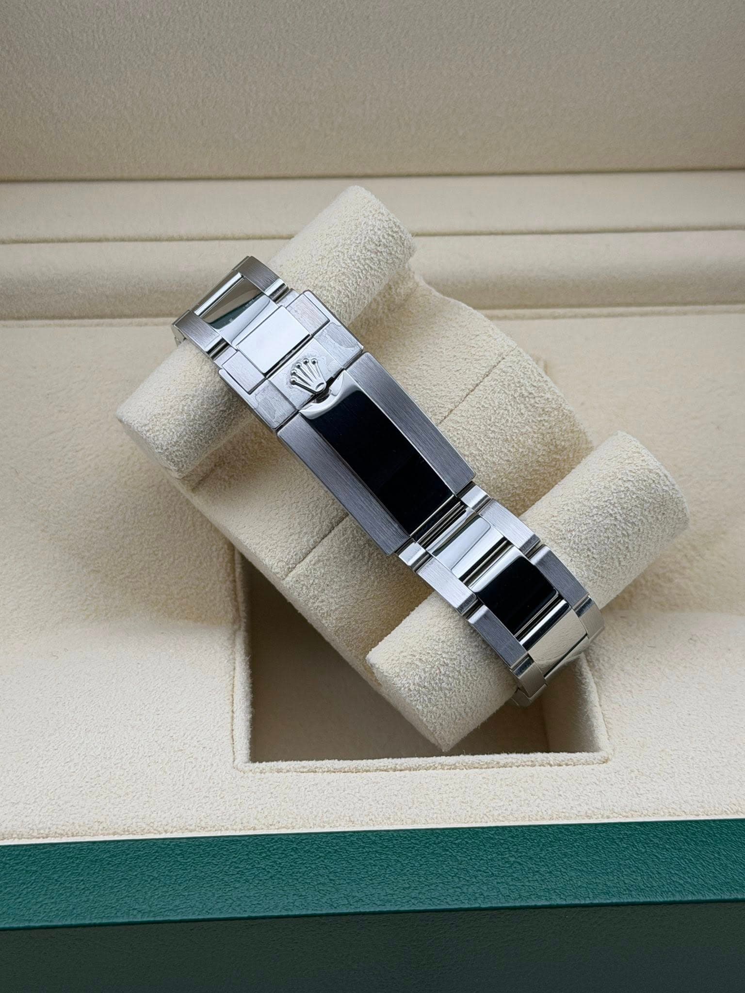 May be an image of wrist watch, ring and text