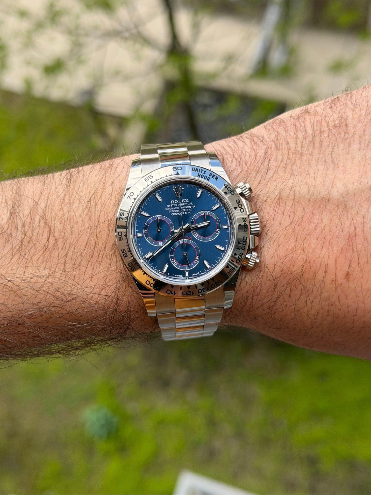 May be an image of wrist watch and text