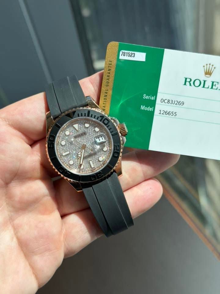 May be an image of wrist watch and text that says '781523 GUARANTEE ATIONAL ROLE Serial_OC831269 0C83J269 Serial Model 126655 TU'