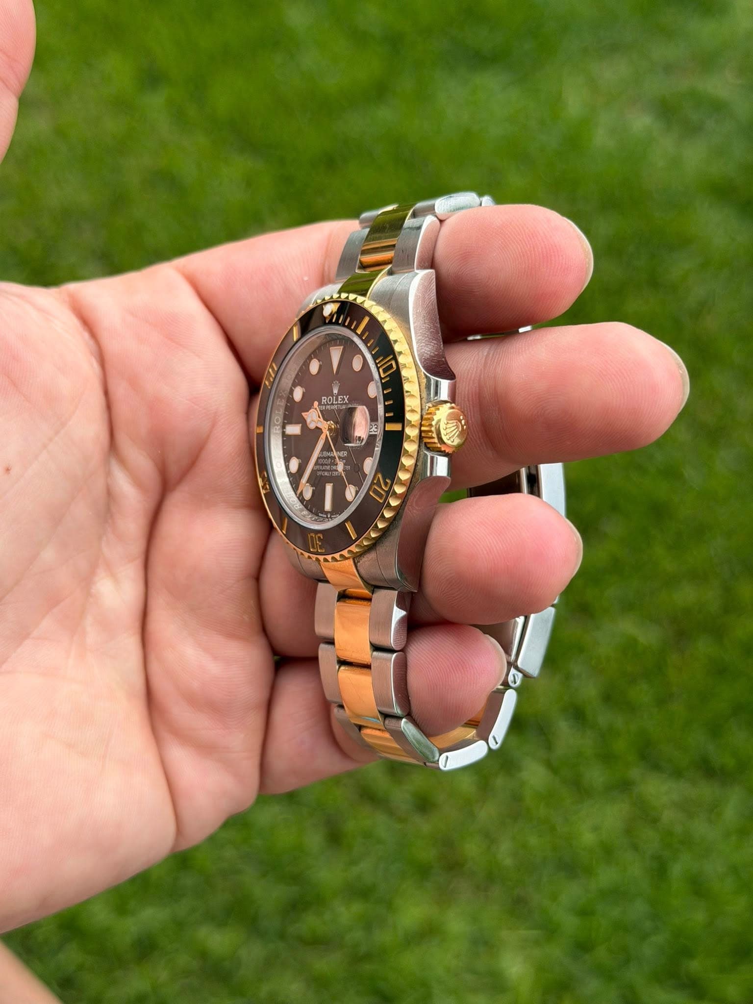 May be an image of wrist watch and text that says 'ROLEX'