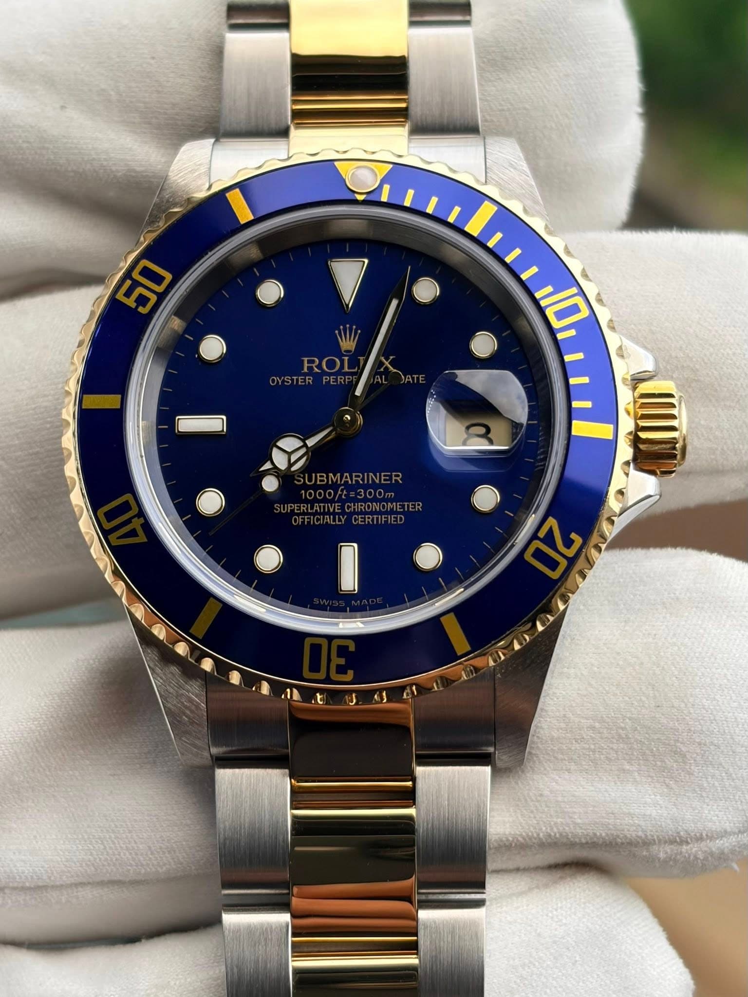 May be an image of wrist watch and text