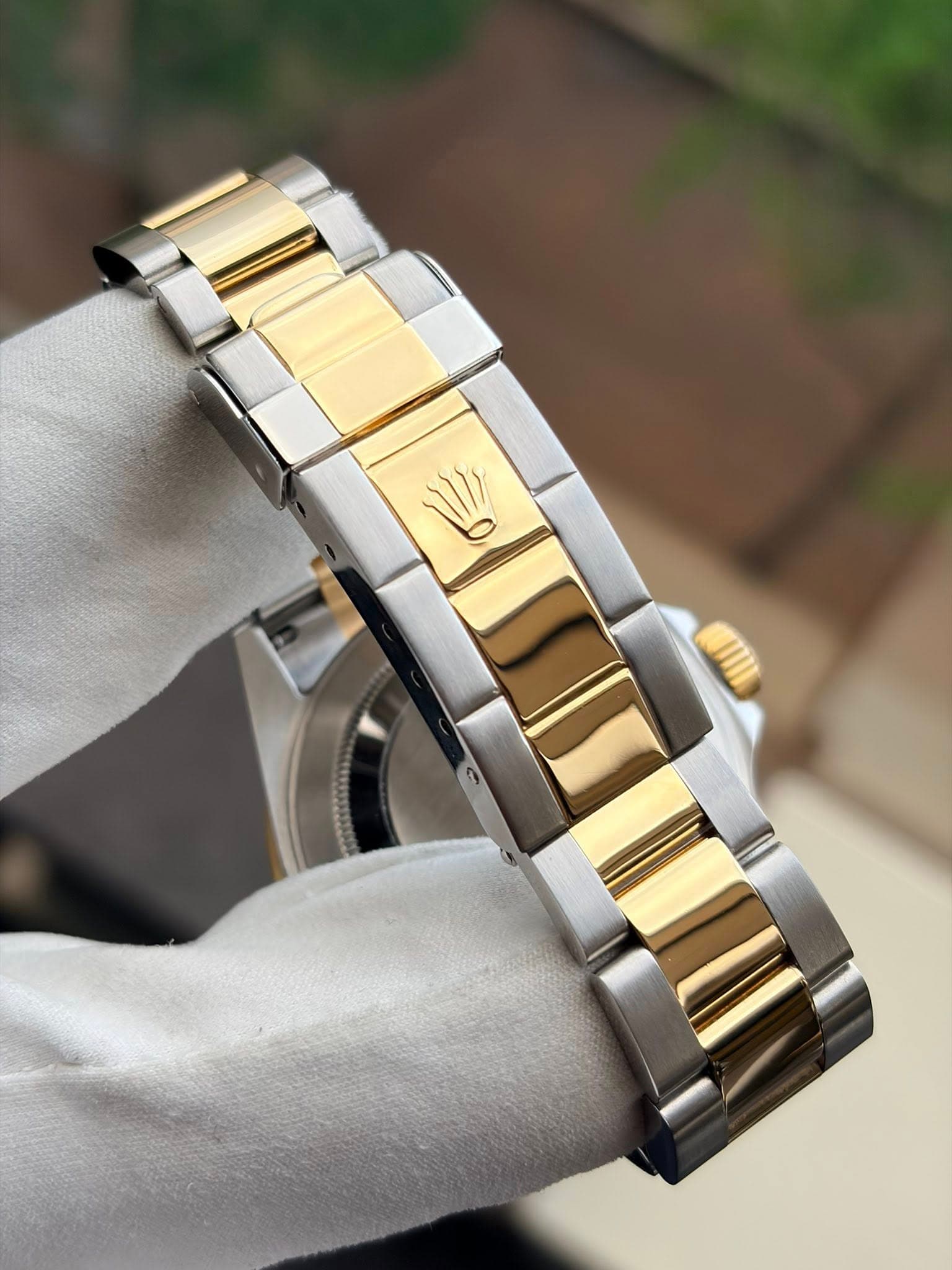 May be an image of wrist watch and text