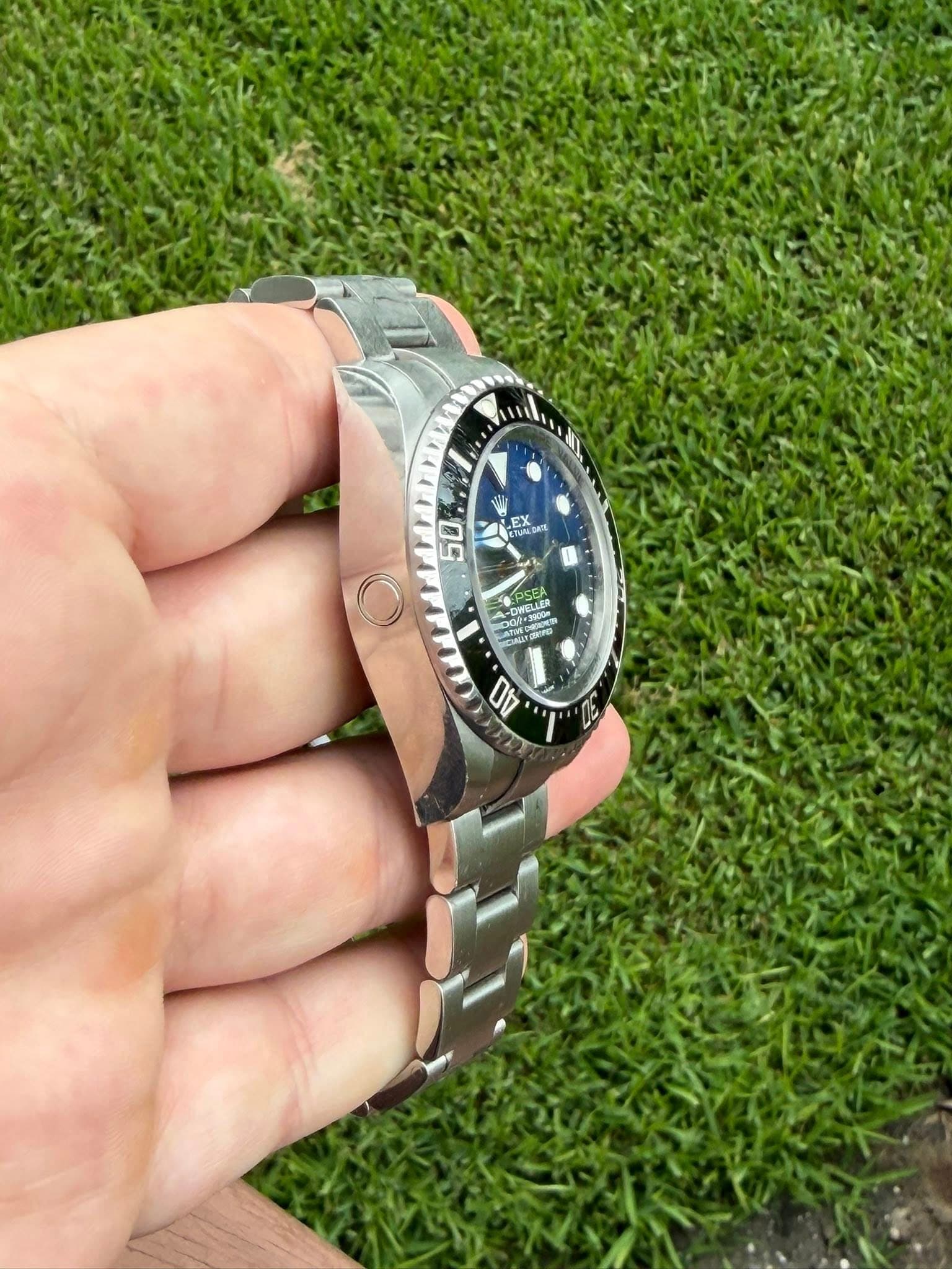 May be an image of wrist watch and text