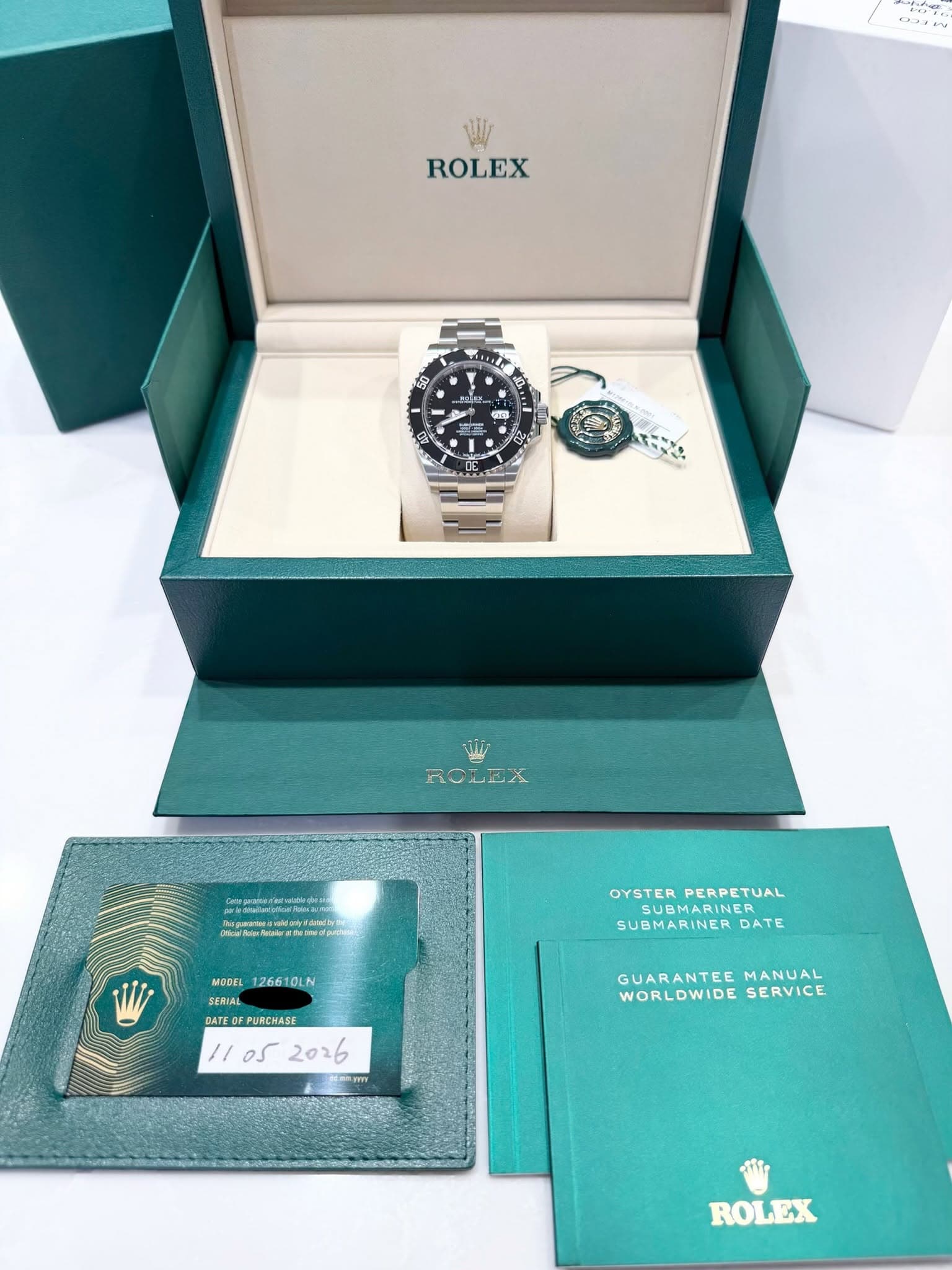 May be an image of wrist watch and text that says '5 ROLEX អ 国 돈전 小 م ROLEX geatwriaraev oNedpm OYSTER OYSTERPERPETUAL PERPETUAL SUBMARINER SUBMARINER SUBMARINERDATE DATE MODEL…