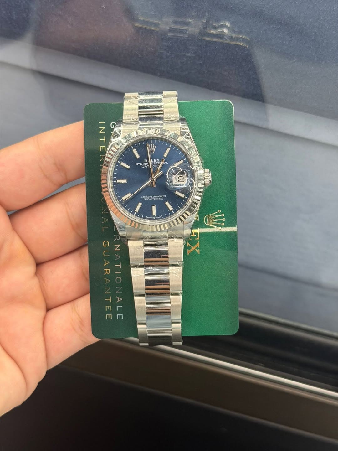 May be an image of wrist watch and text