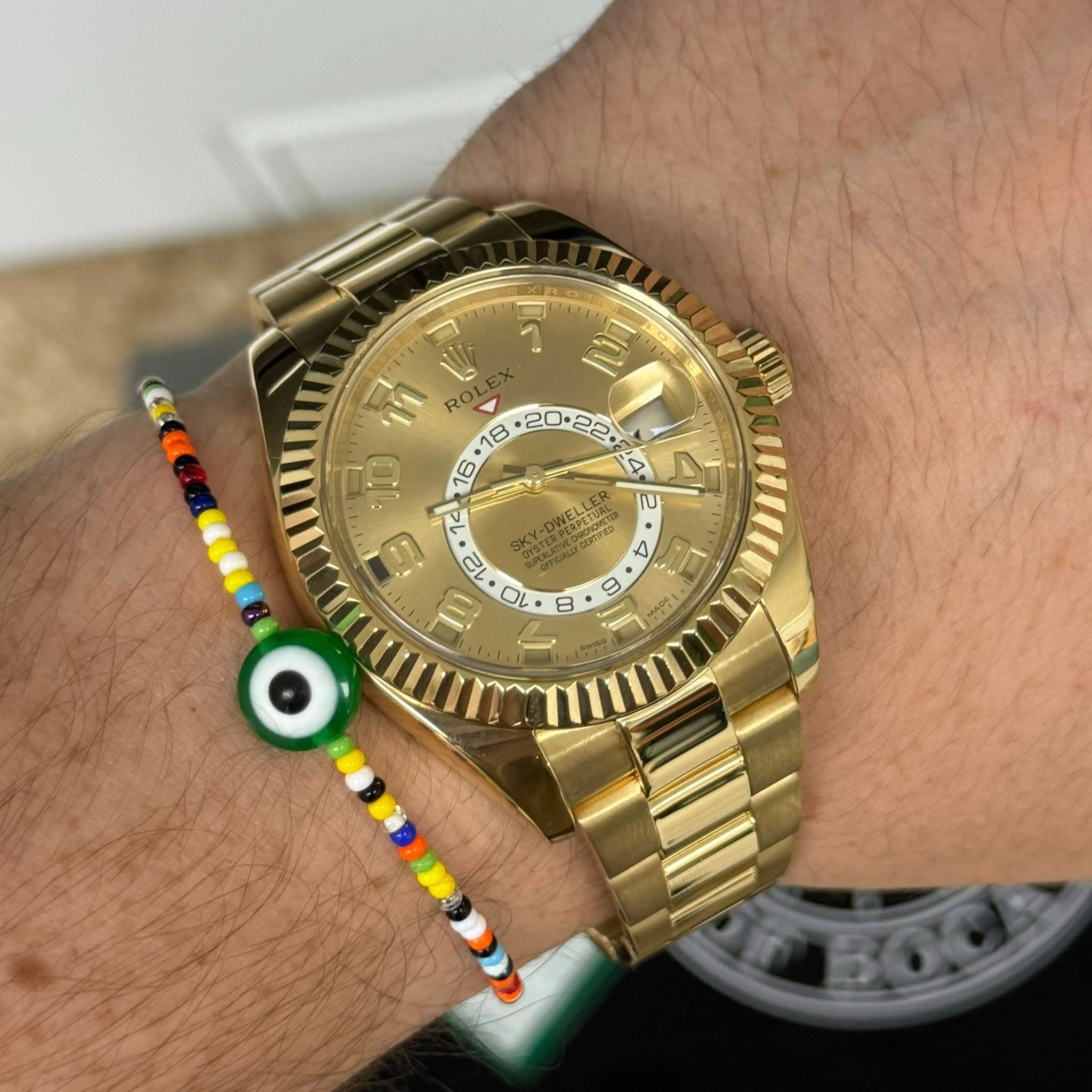 May be an image of wrist watch and text