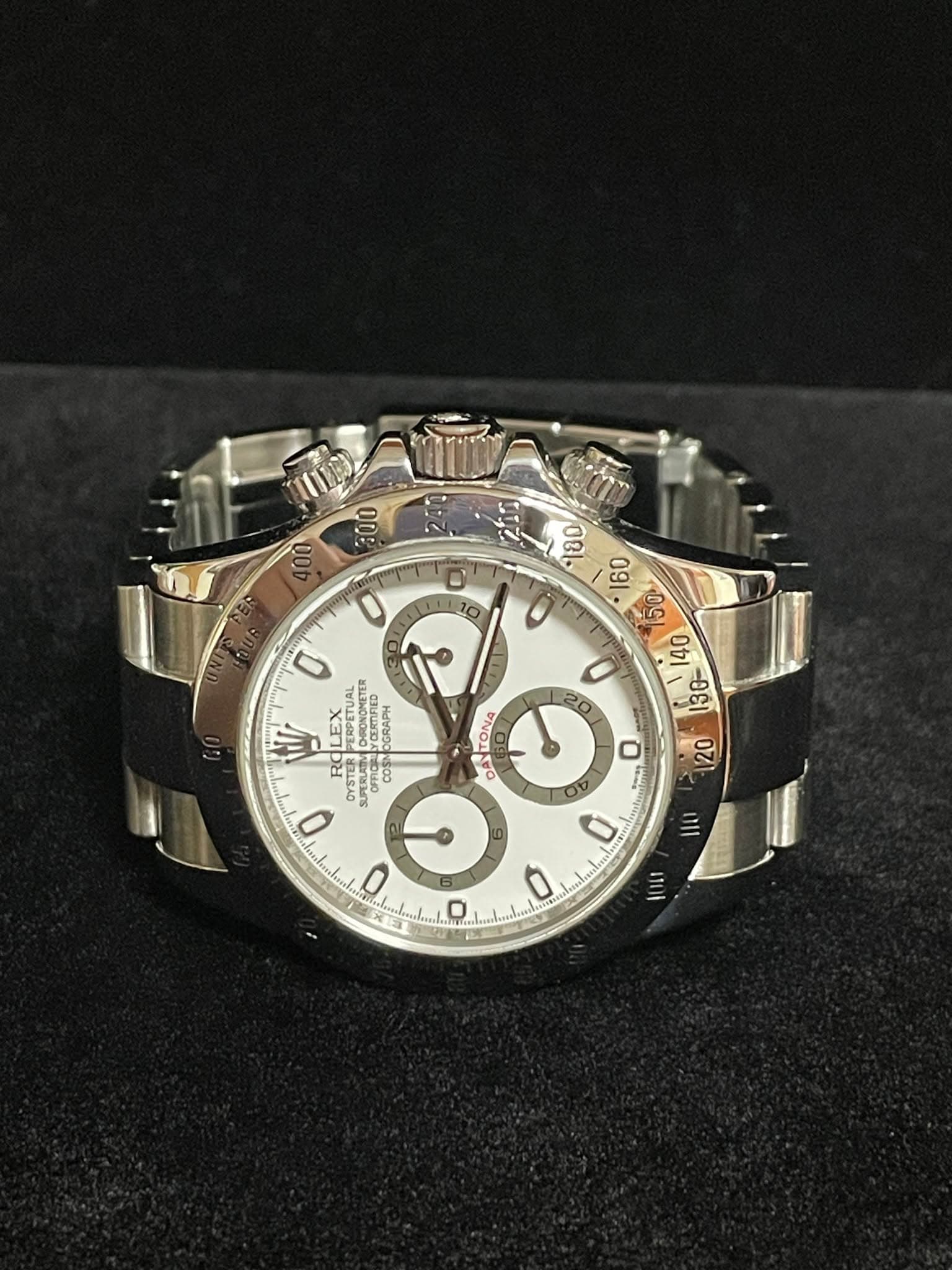 May be an image of wrist watch and text