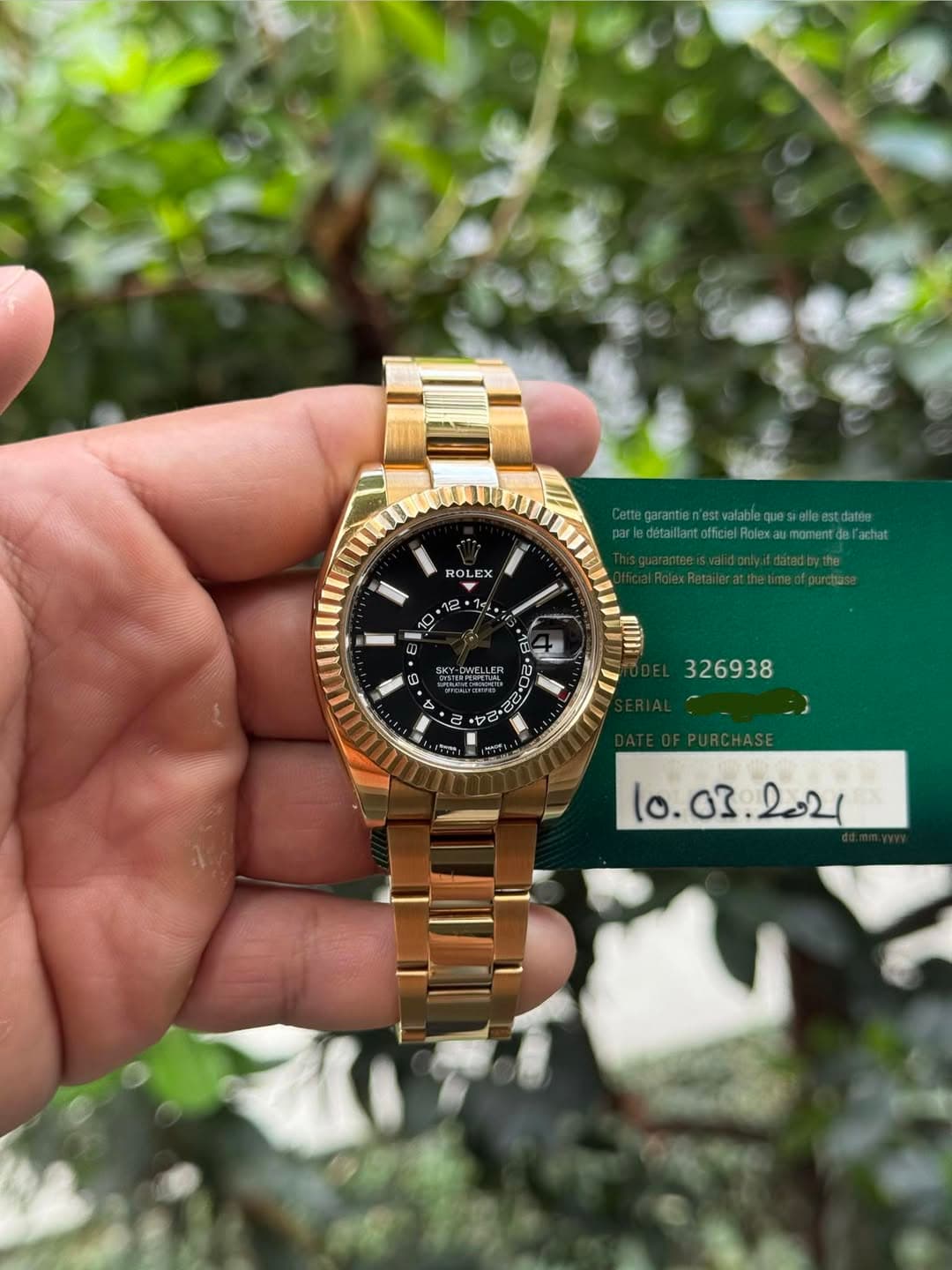 May be an image of wrist watch and text