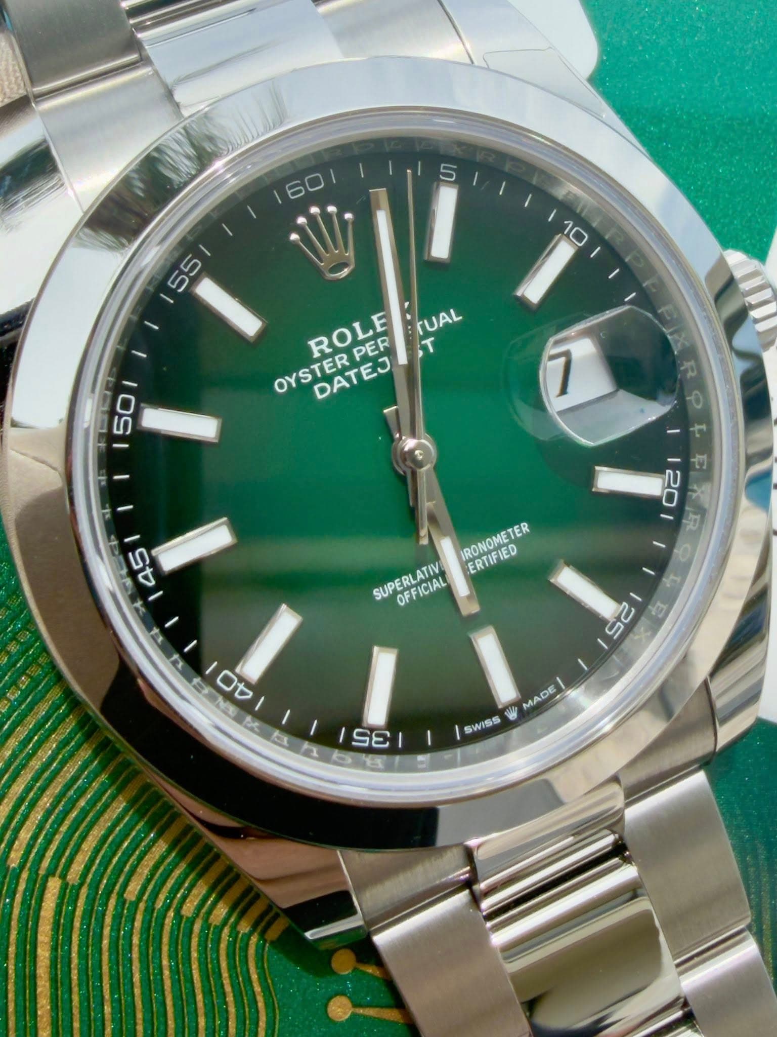 May be an image of wrist watch and text that says '60 55 10 ROLE PER T TUAL OYSTER DATEJ 50 7 PIX R ዋ 45 20 ቴ 京 IRONOMETE TER ERTIFIED SUPERLATN SUPERFICIAL SUPERLATIV OFFICIAL 2S…