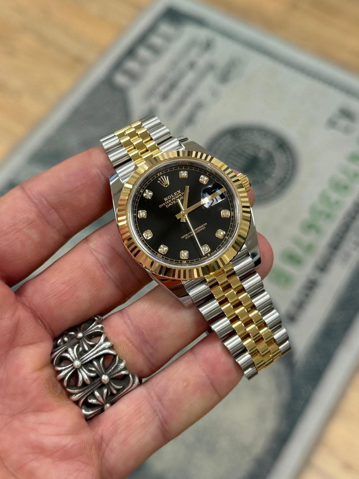 May be an image of wrist watch and text