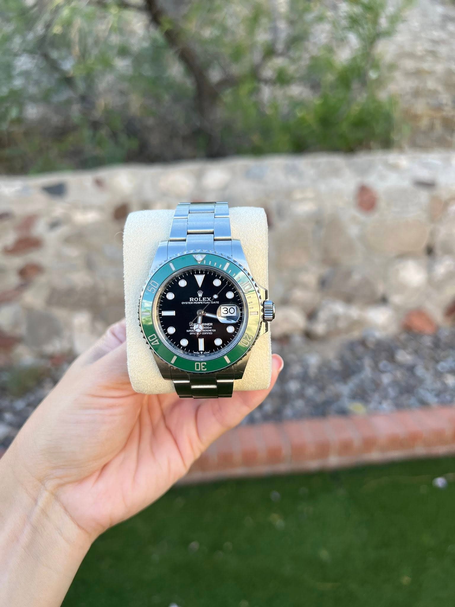 May be an image of wrist watch and text