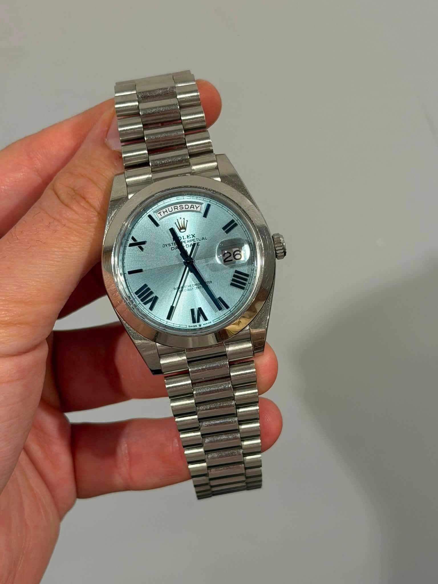 May be an image of wrist watch and text