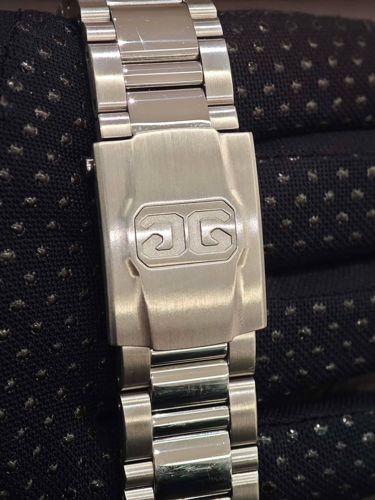 May be an image of wrist watch and text
