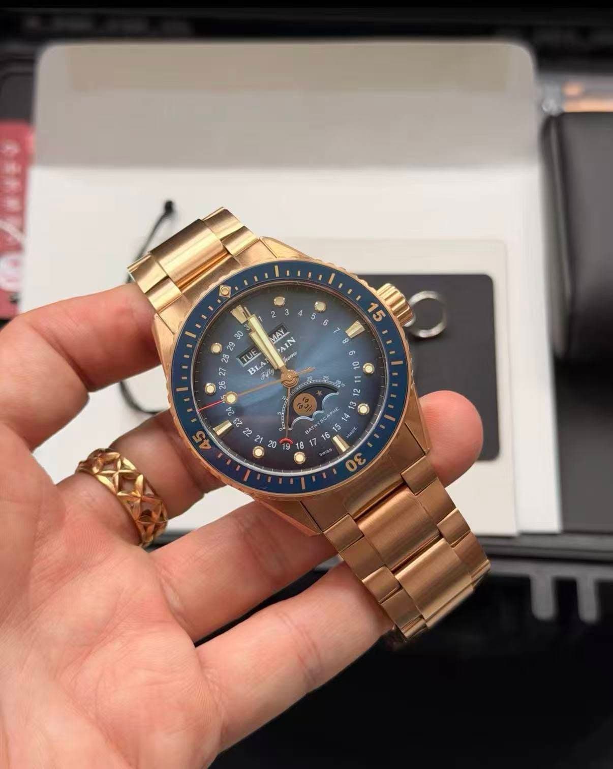 May be an image of wrist watch and text