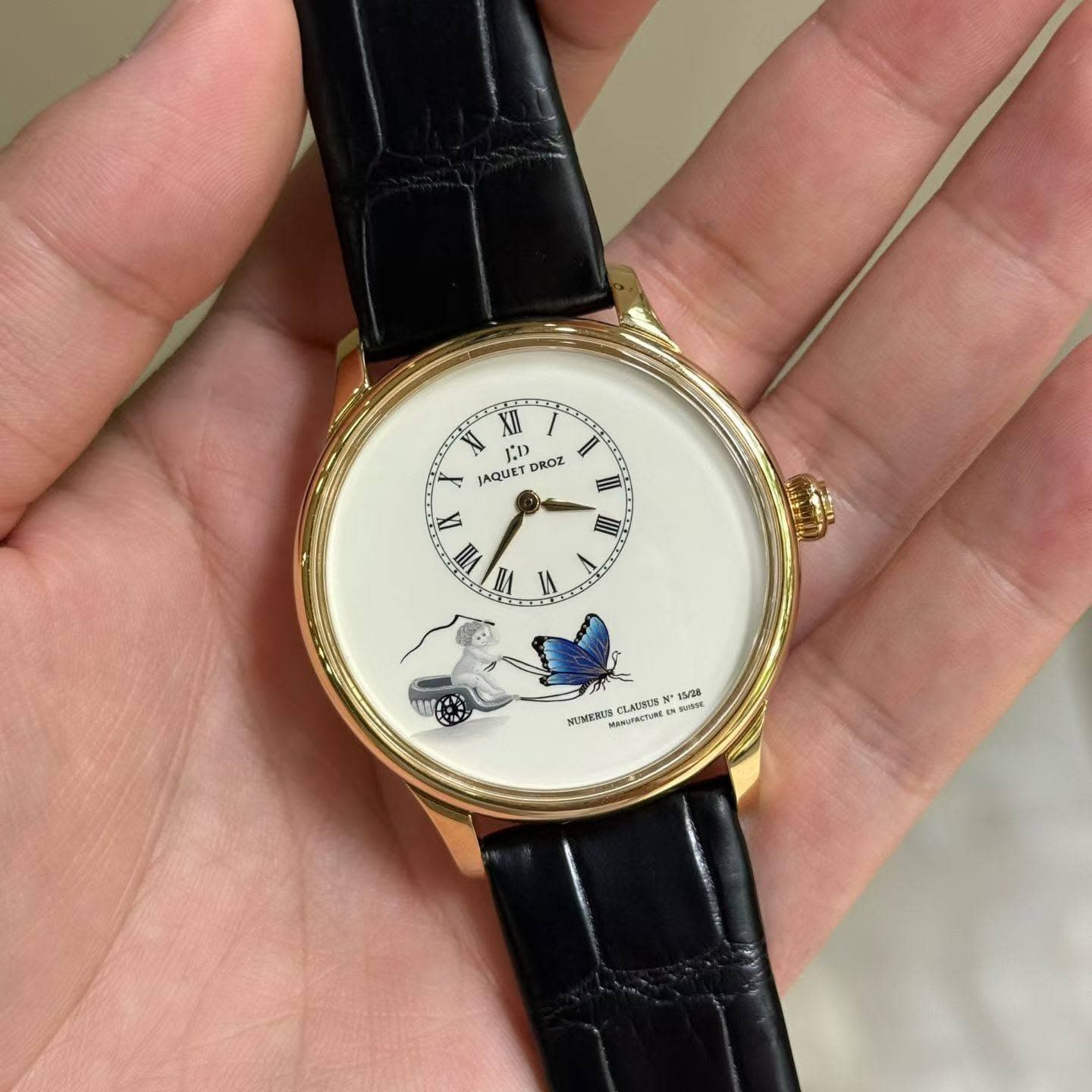 May be an image of wrist watch and text