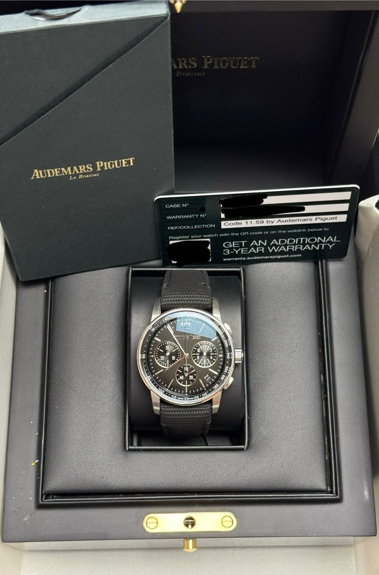 May be an image of wrist watch and text that says 'AUDEMARS AUDEMARS Le 6yaHH PIGUET CASE WARFANTYN DEEICOLLECTION Codo 1.59 by Audemars Piguet 3-YEARWARRANT 3-YEAR WARRANT GET…