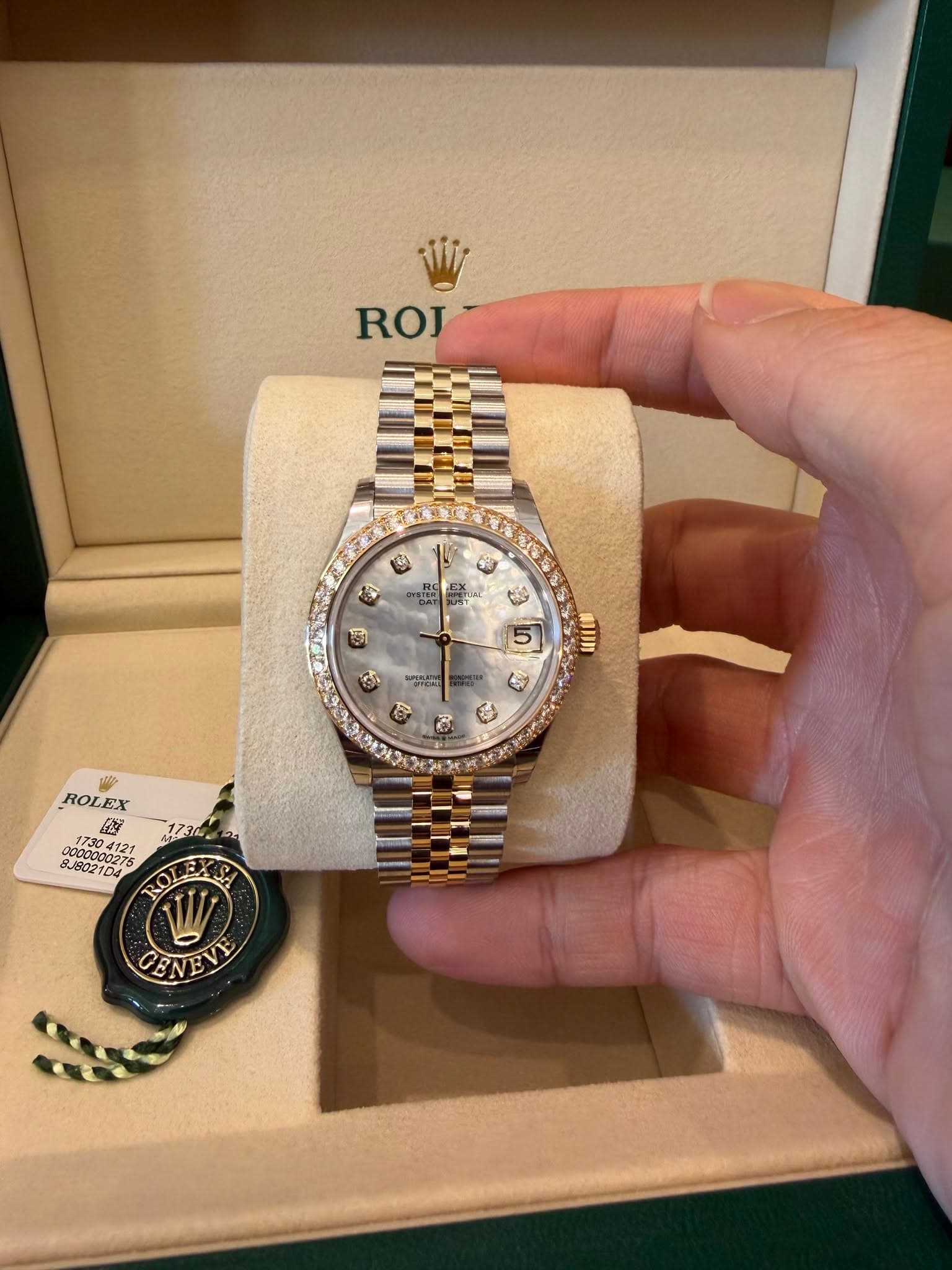 May be an image of wrist watch and text