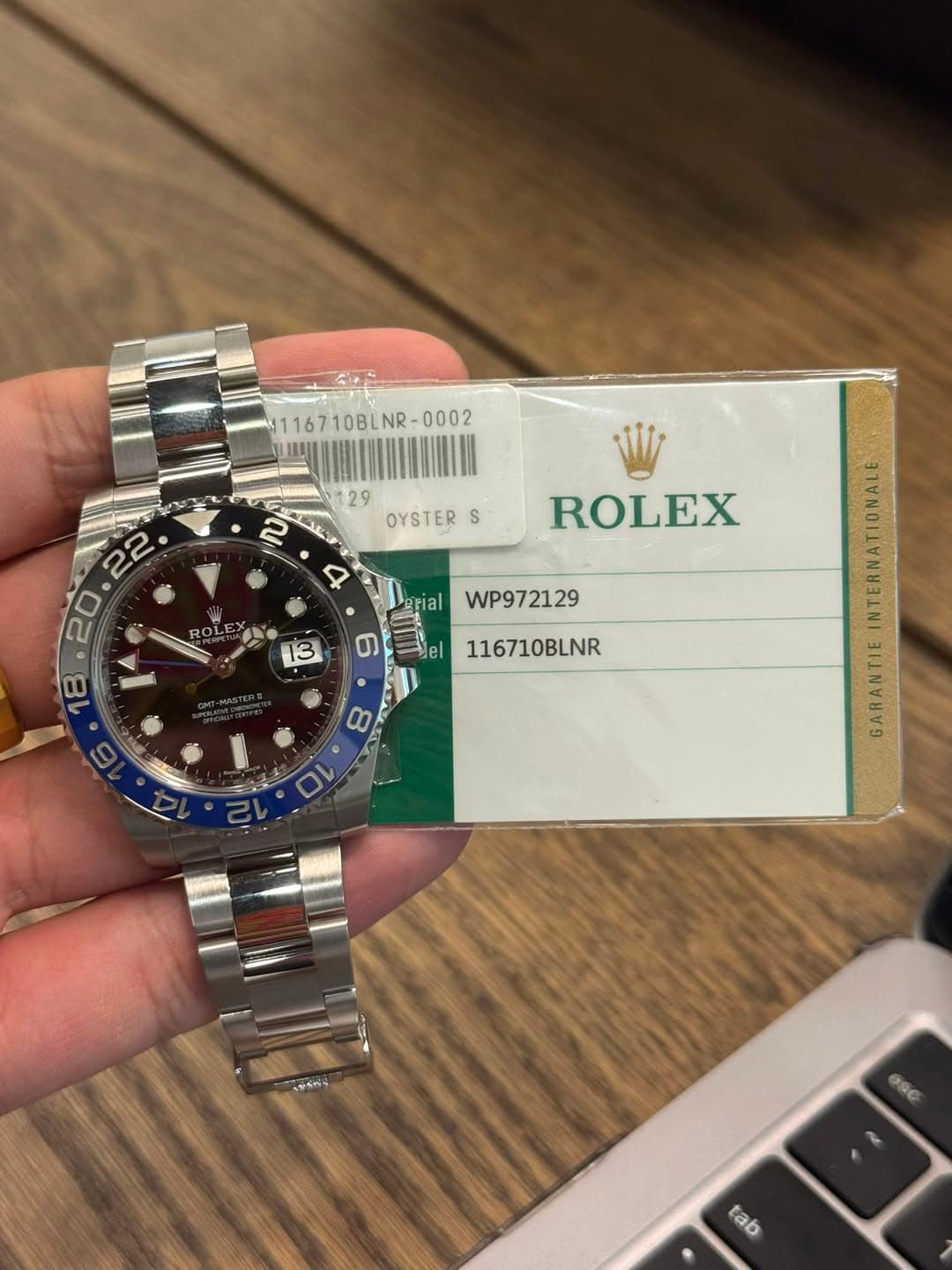 May be an image of wrist watch and text that says '116710BL 116710BLNR- OYSTER S • P OLE ROLEX Fial 13 WP972129 ത del 116710BLNR 00 10 GARANTIE .みう六 GSC tab'