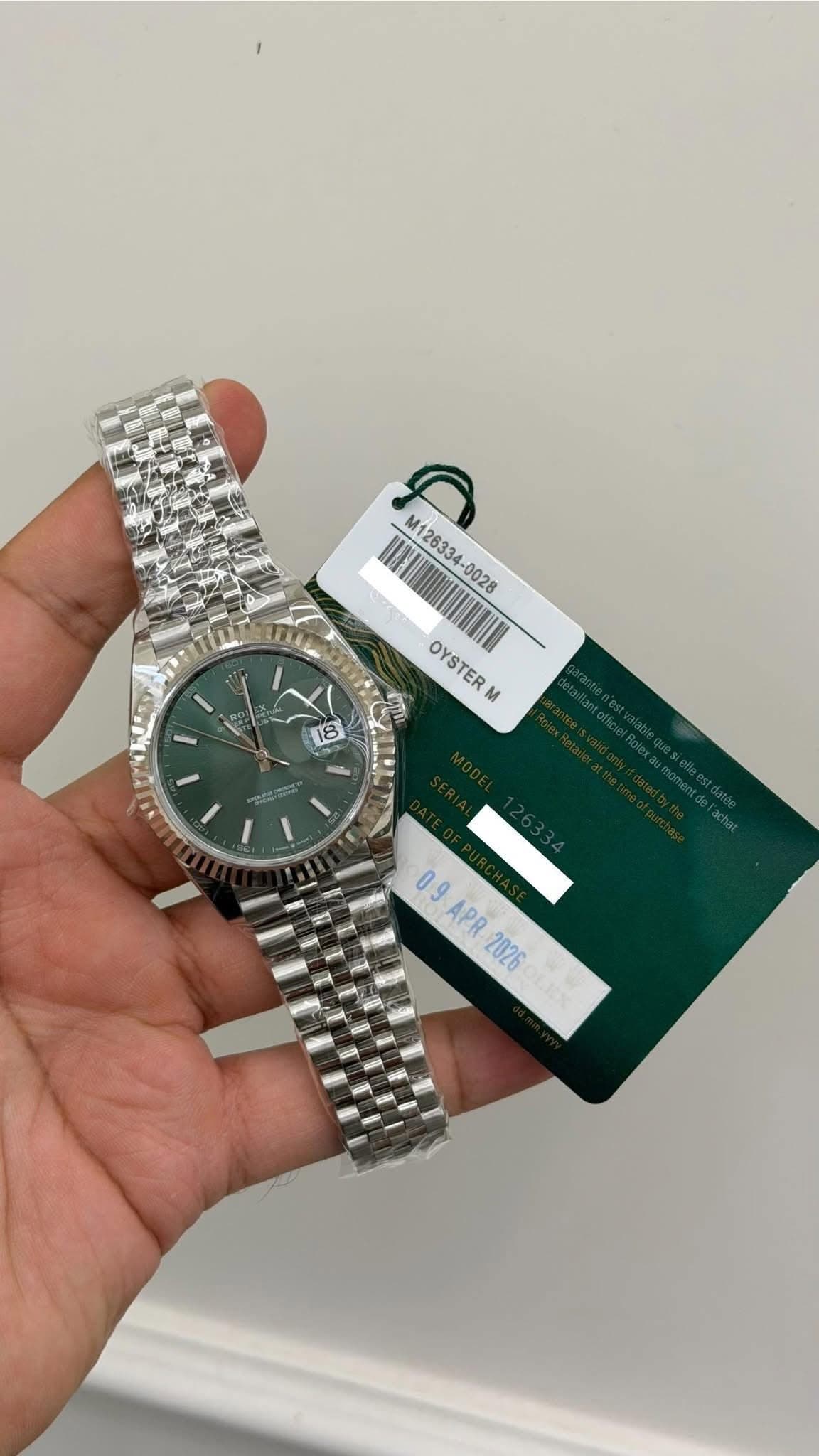 May be an image of wrist watch and text that says '1 M126334 OYSTERN M H mm 18 09APR2026 09 APR 2026'
