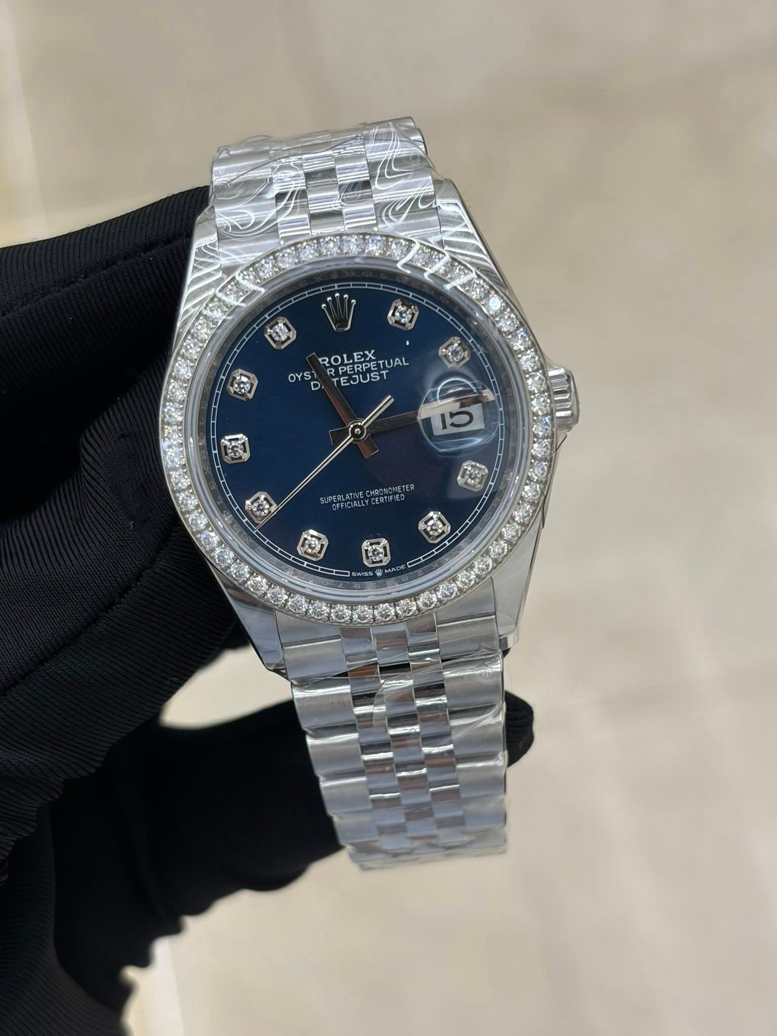 May be an image of wrist watch and text that says 'OYS ROLEX RPERPE RPERPET UAL EJUST BB 国 ធី ជ្នាំ ট'