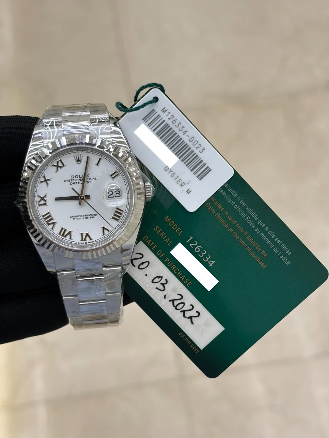 May be an image of wrist watch and text