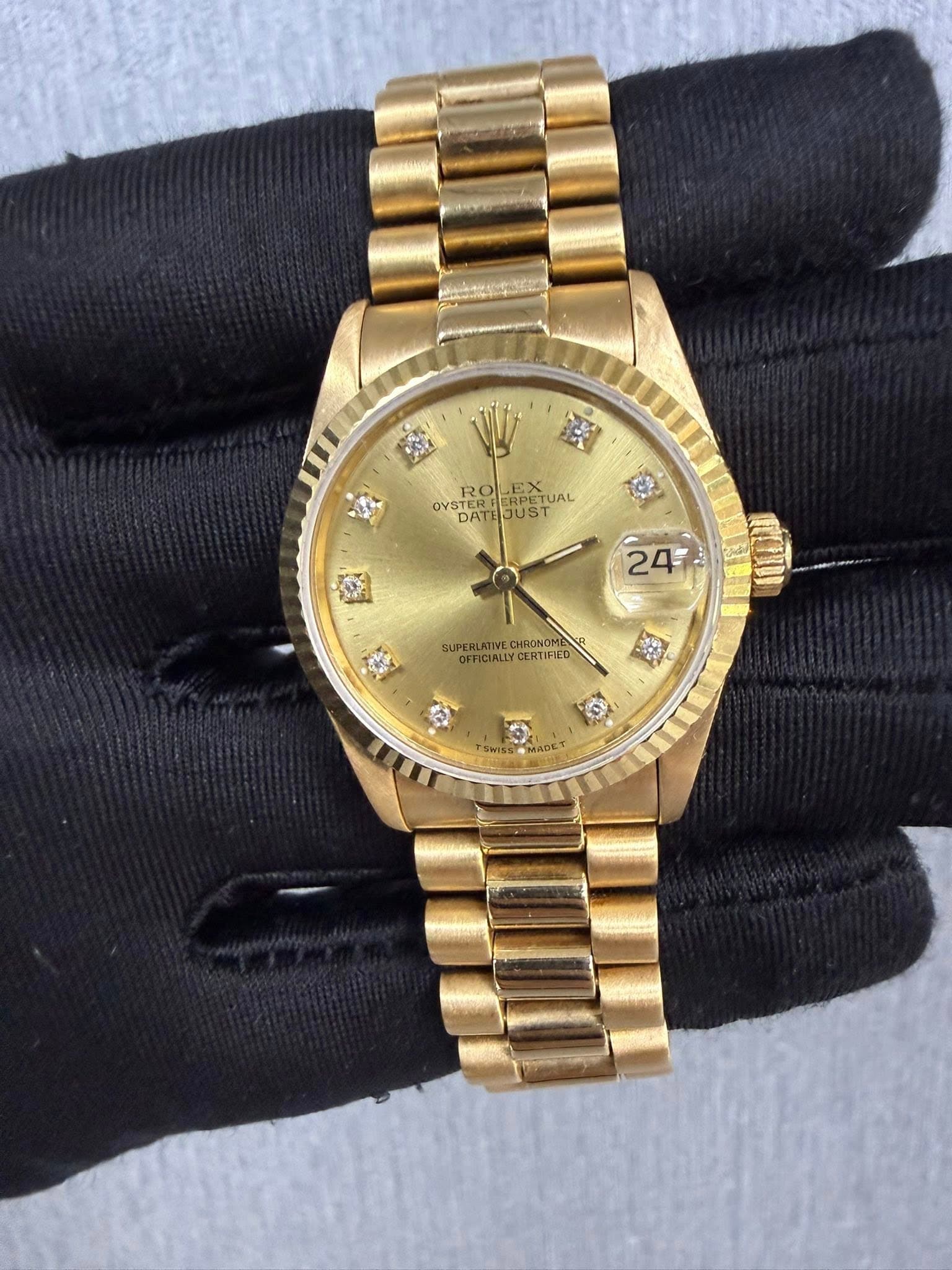 May be an image of wrist watch and text