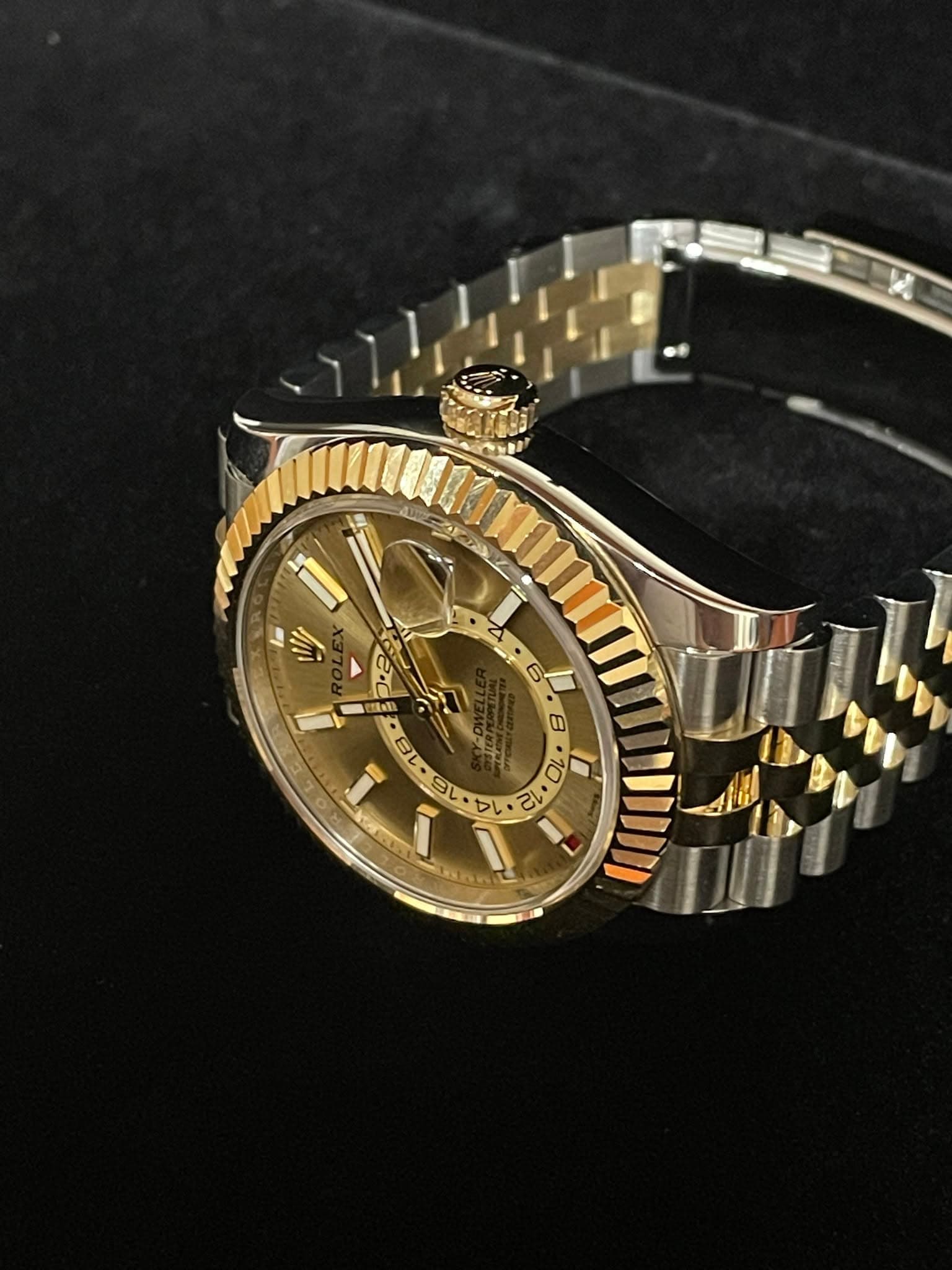 May be an image of wrist watch and text