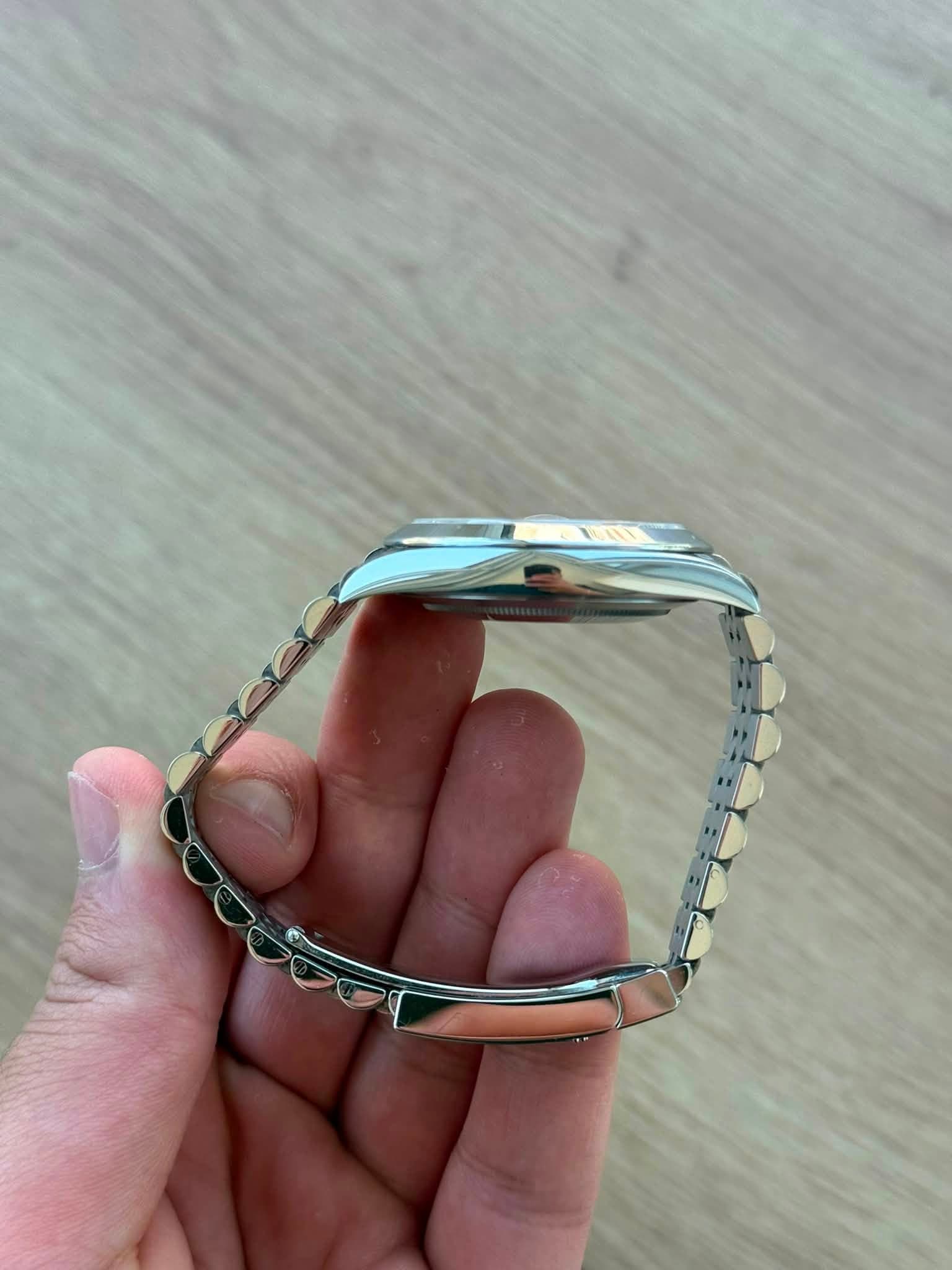 May be an image of jewelry and wrist watch