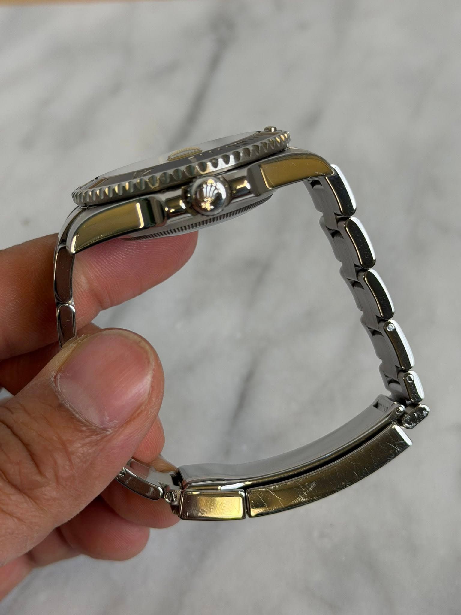 May be an image of wrist watch