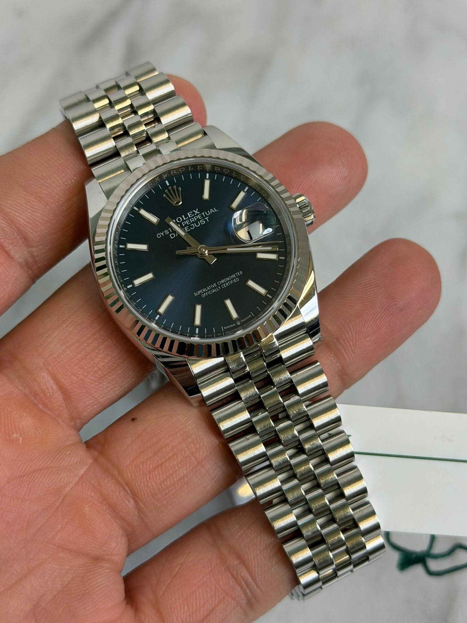 May be an image of wrist watch and text