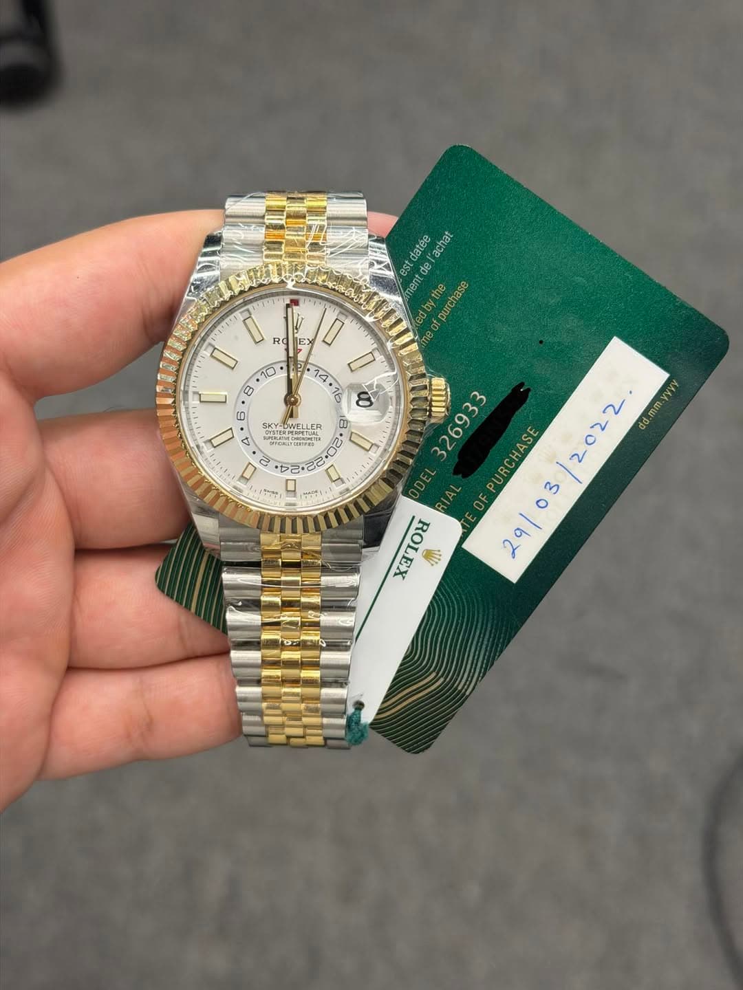May be an image of wrist watch and text