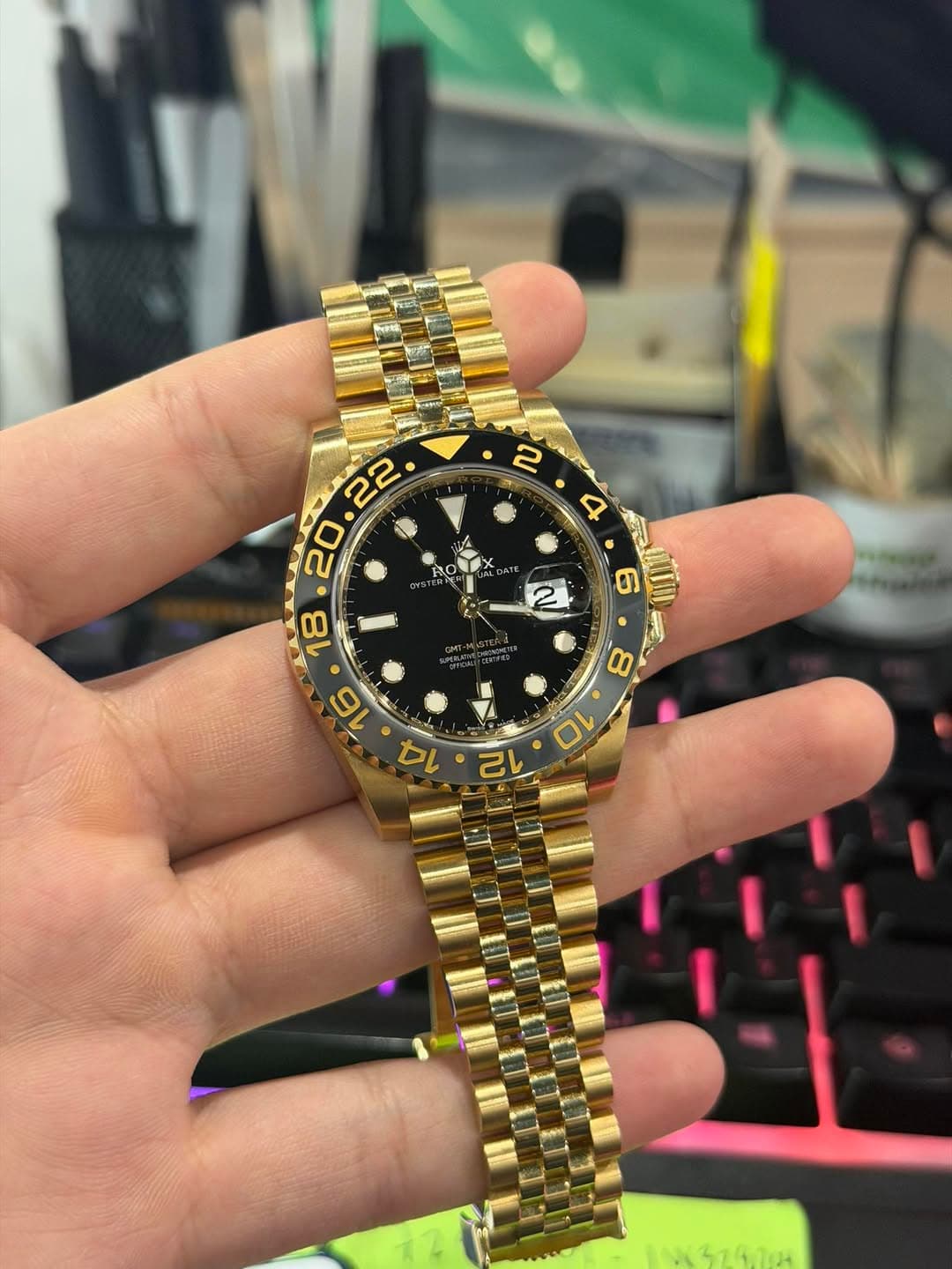 May be an image of wrist watch and text