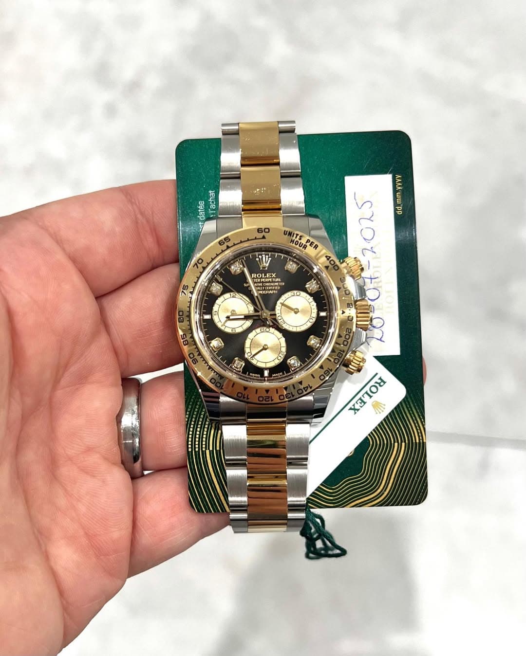 May be an image of wrist watch and text