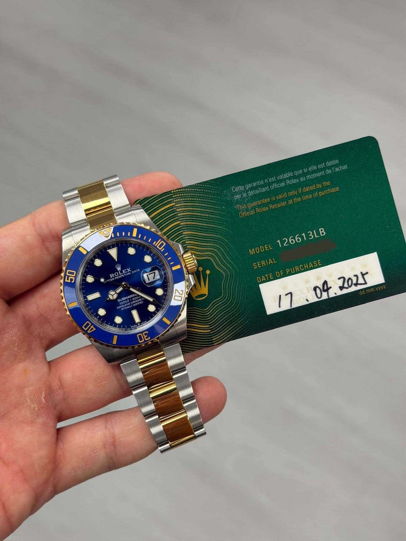 May be an image of wrist watch and text that says '10 50 ROLEX 17 一 20 2 0G 0V 126613LB 3LB '