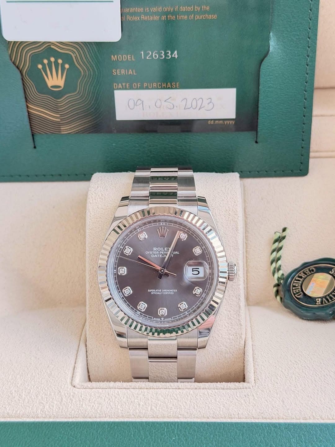 May be an image of wrist watch and text