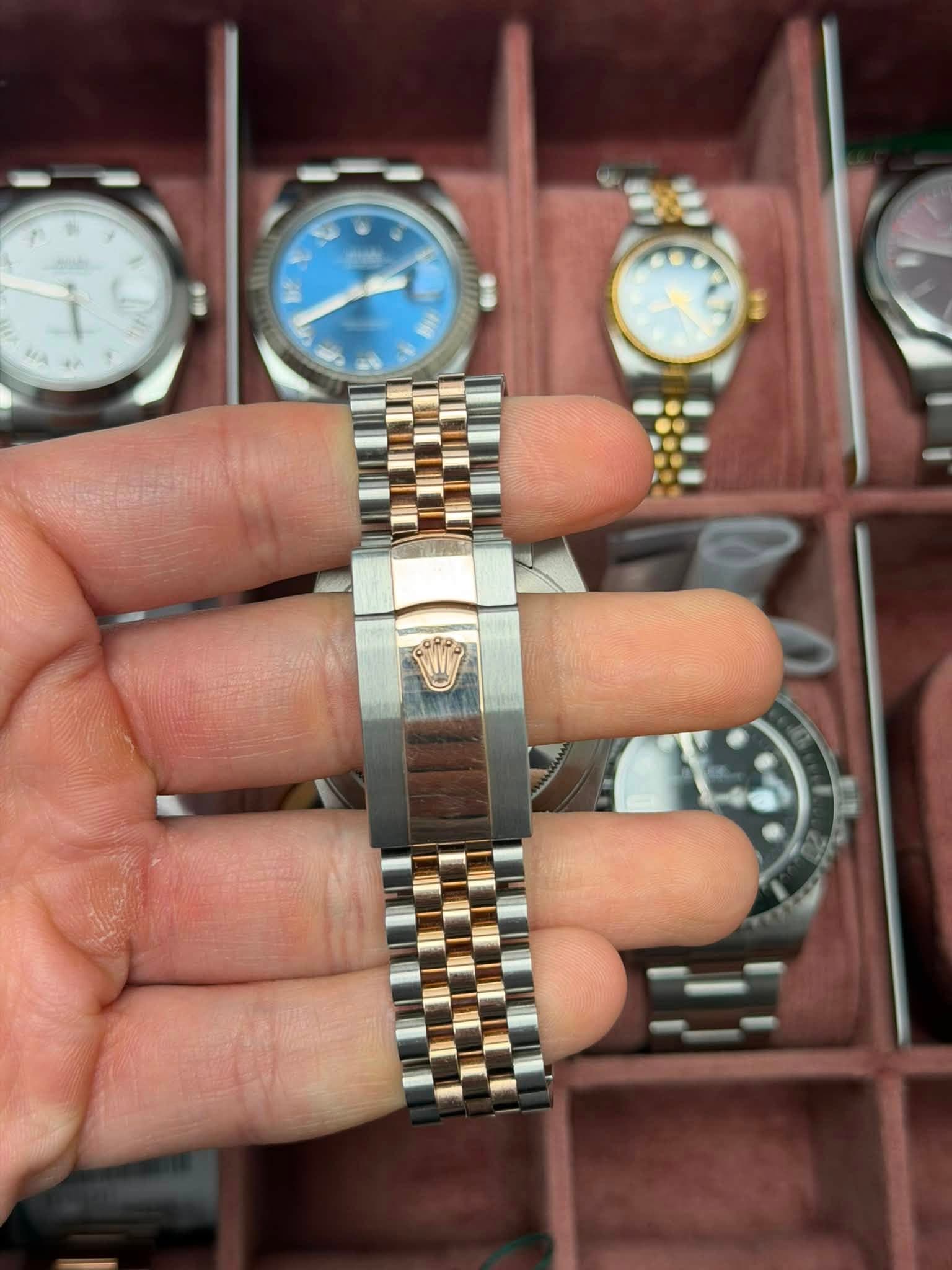 May be an image of wrist watch and text