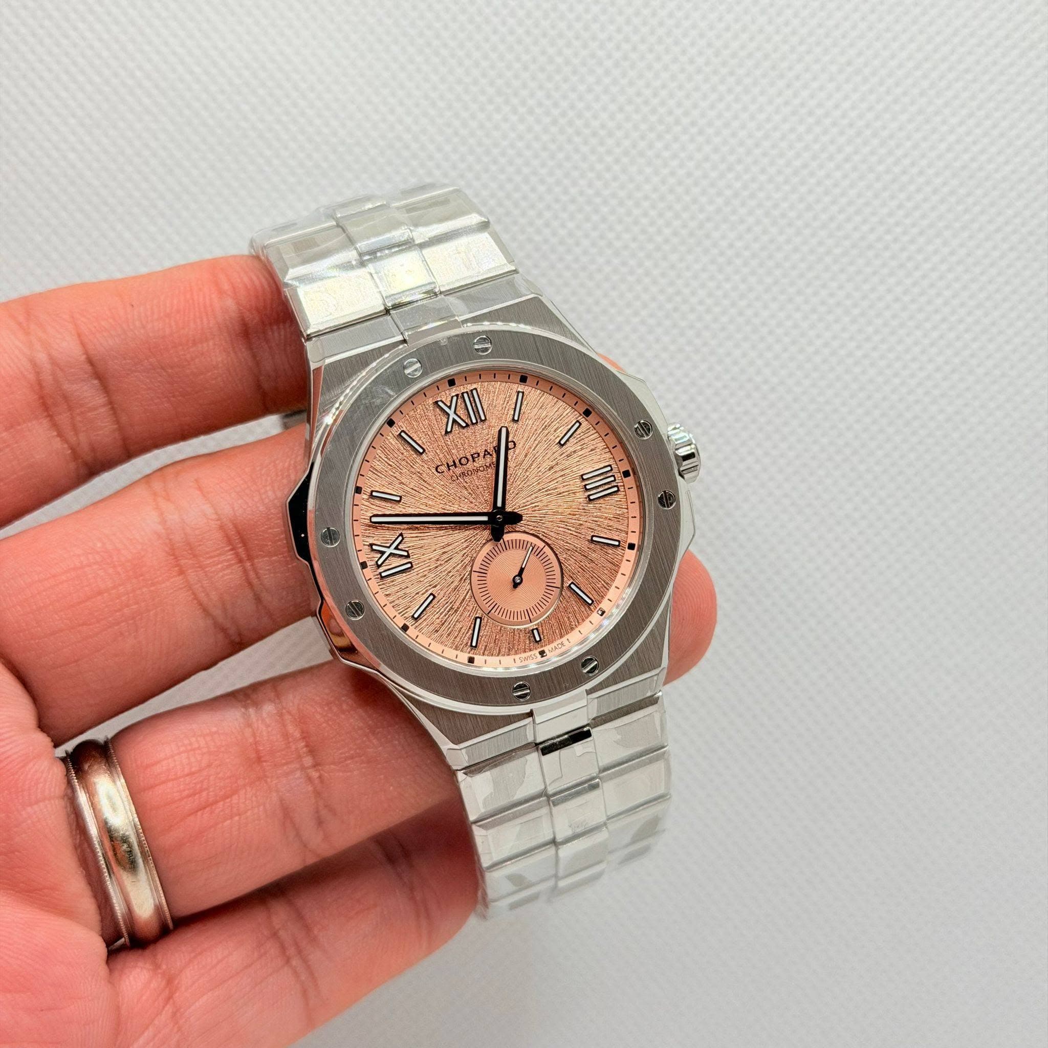 May be an image of wrist watch and text