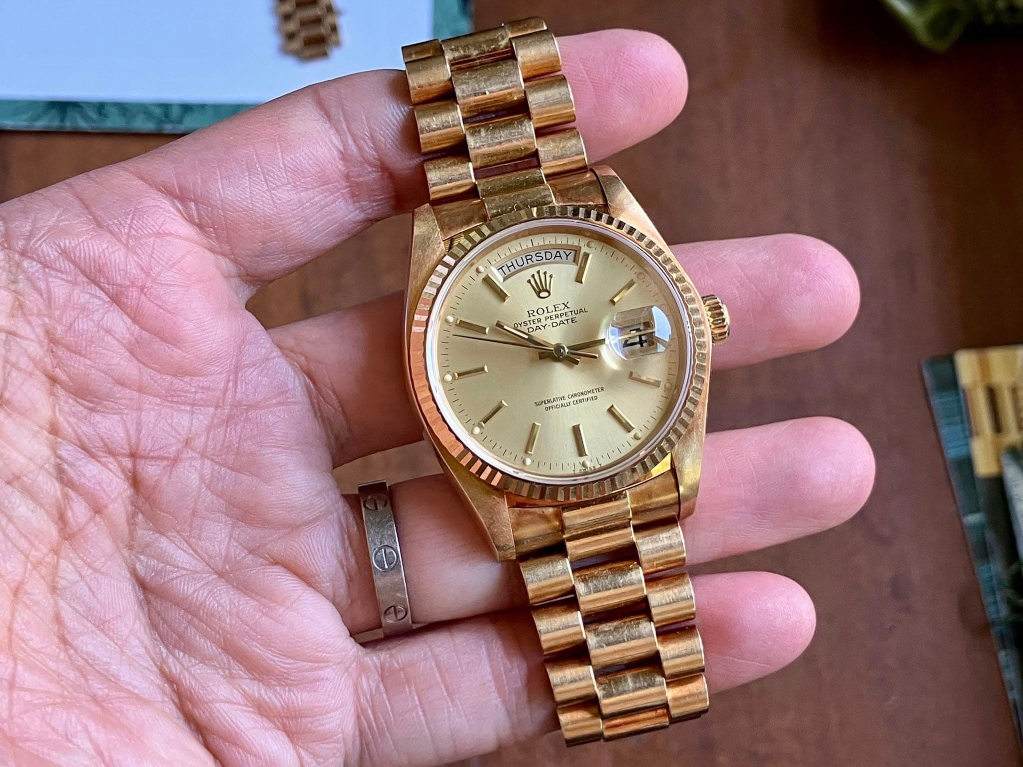 May be an image of wrist watch and text