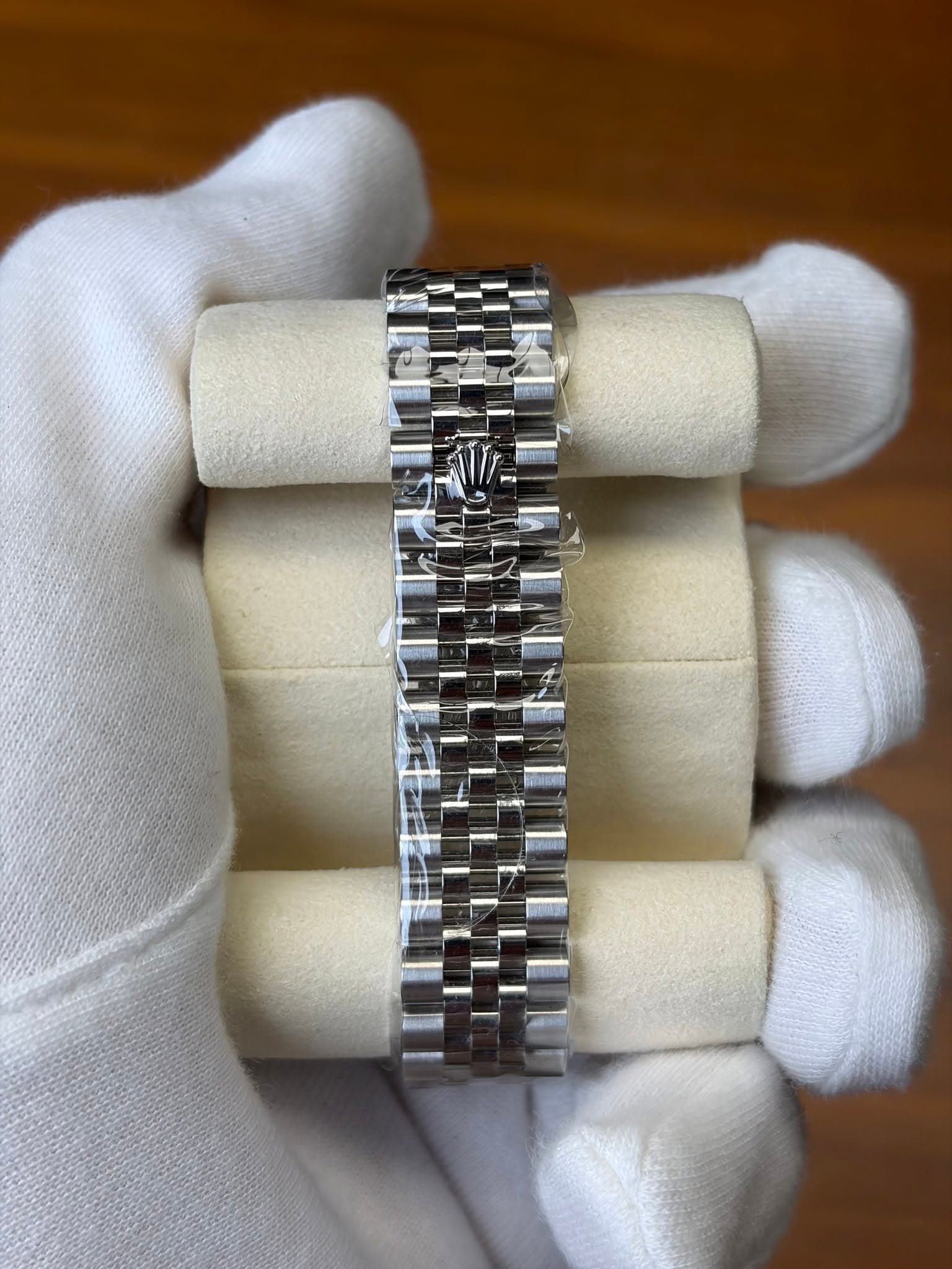 May be an image of wrist watch and jewelry