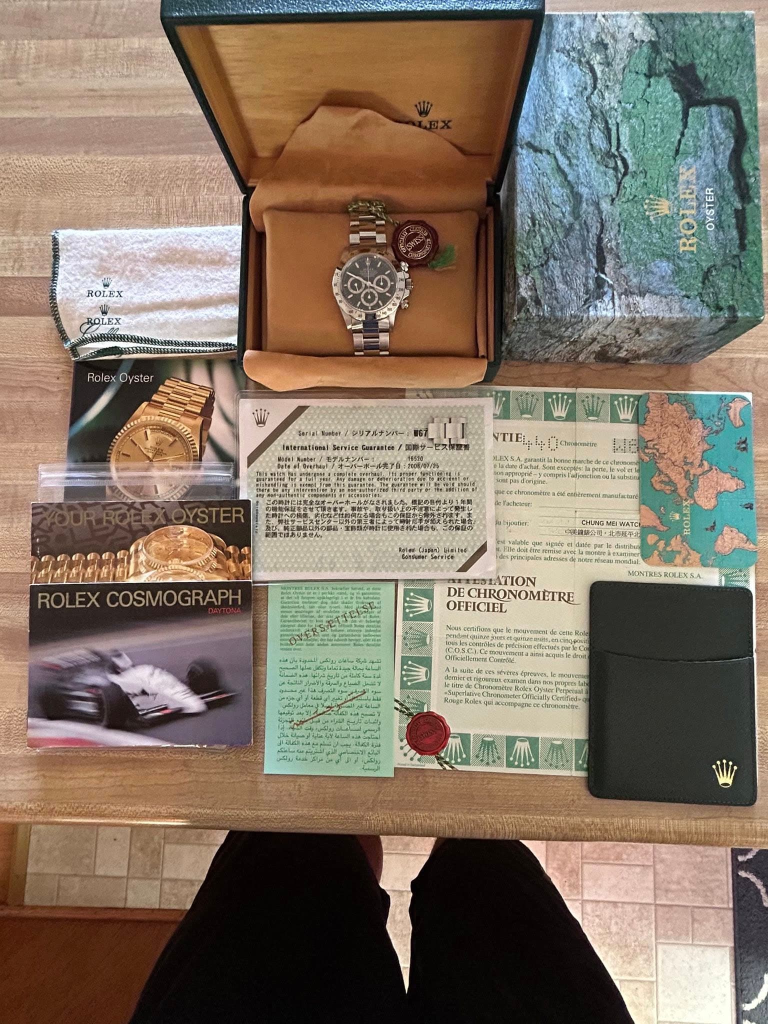 May be an image of wrist watch, map and text
