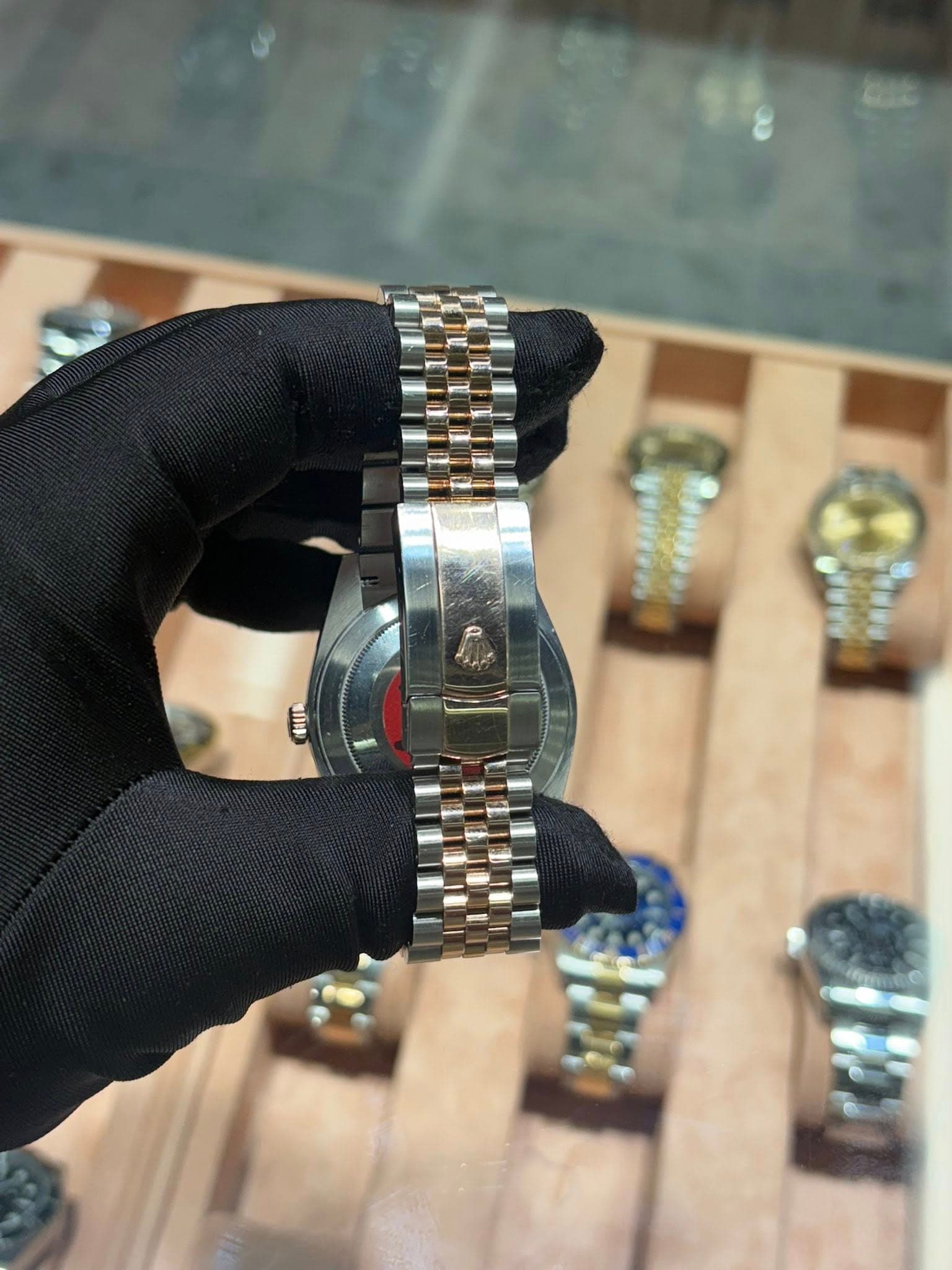 May be an image of wrist watch and text