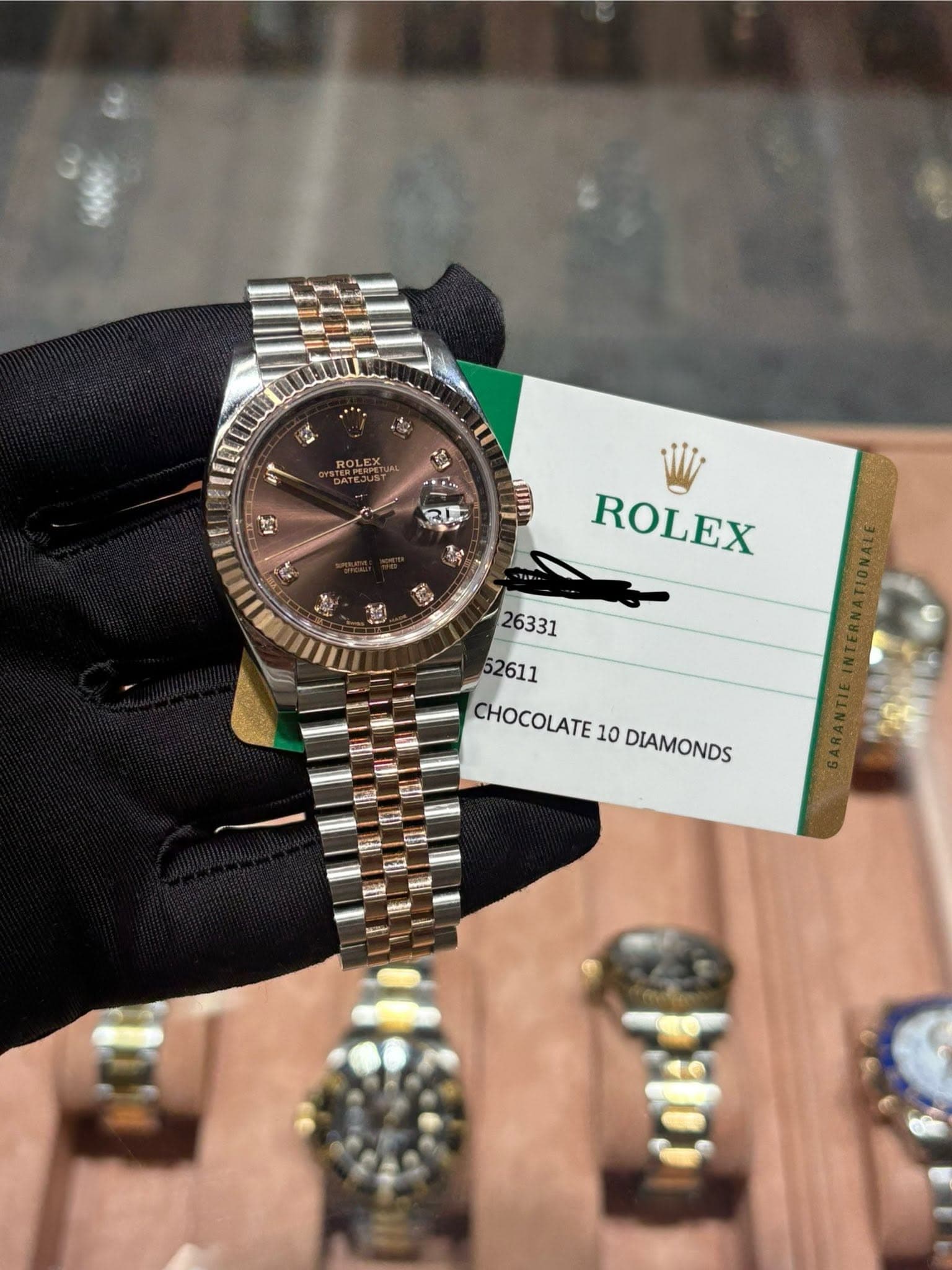 May be an image of wrist watch and text that says 'ROLEX. ඒු da ROLEX CHOCOLATE 10 DIAMONDS m'