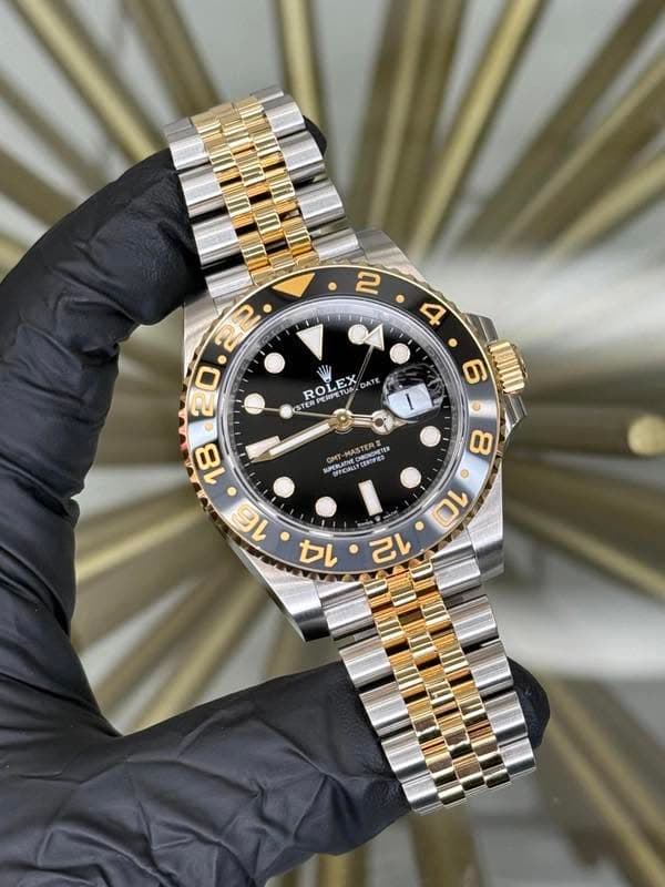 May be an image of wrist watch and text
